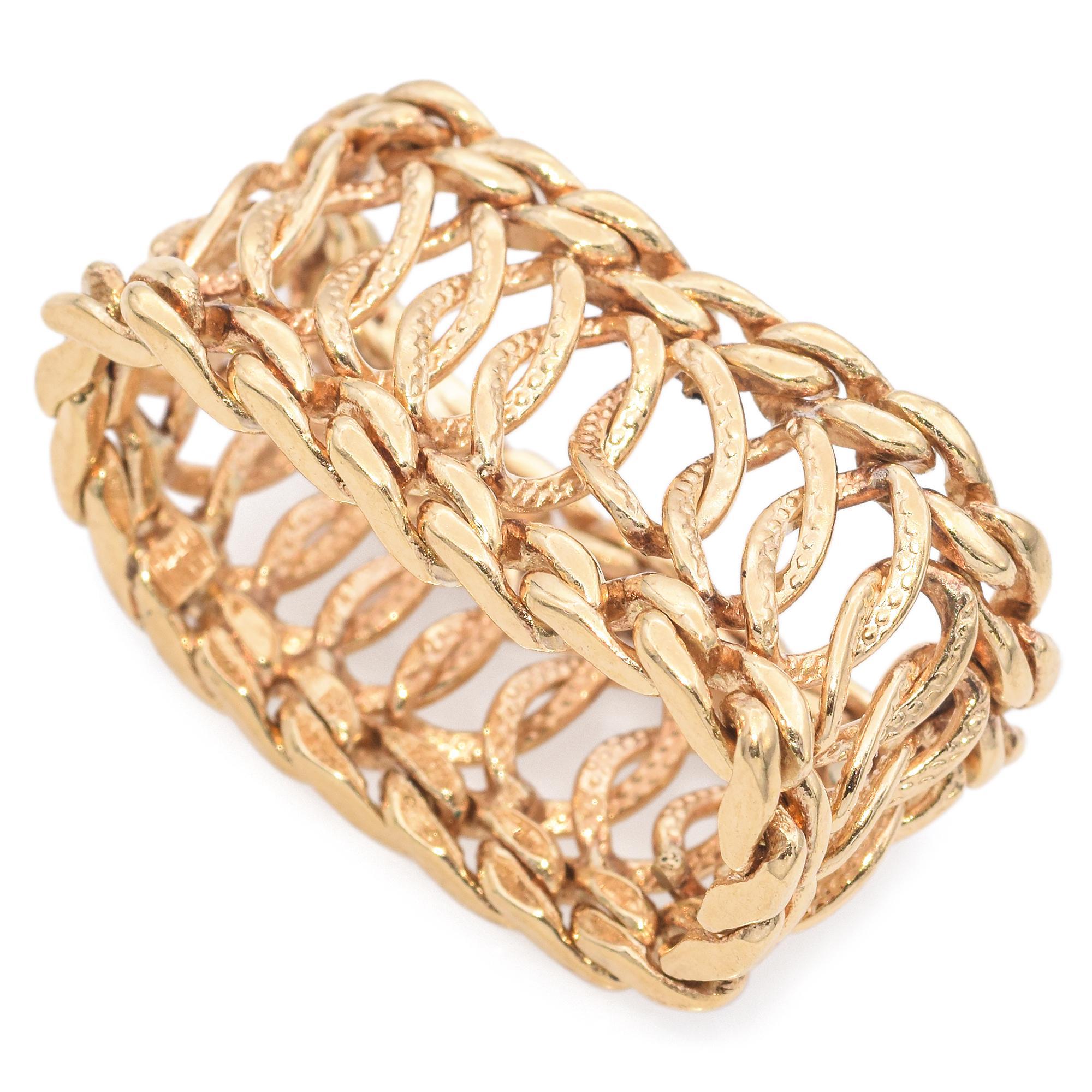 A study in texture, form, and elegance. This striking ring showcases an intricate woven design in 14k yellow gold. The interlocking loops create a captivating pattern, adding depth and dimension to the piece.

Weight: 7.0 Grams 
Measurements: 11.77