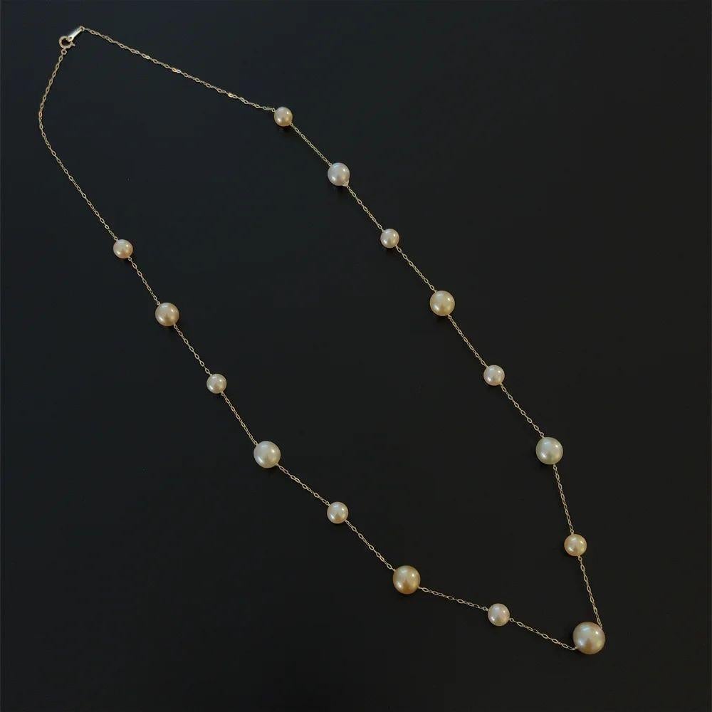 Simply Beautiful! South Sea Golden and White Pearl Necklace, comprising 15 South Sea Golden and White Pearls, each measuring approx. 8.5mm-12.5mm inter-spaced with an 18K Yellow Gold link chain. The necklace measures approx. 30” long. More Beautiful