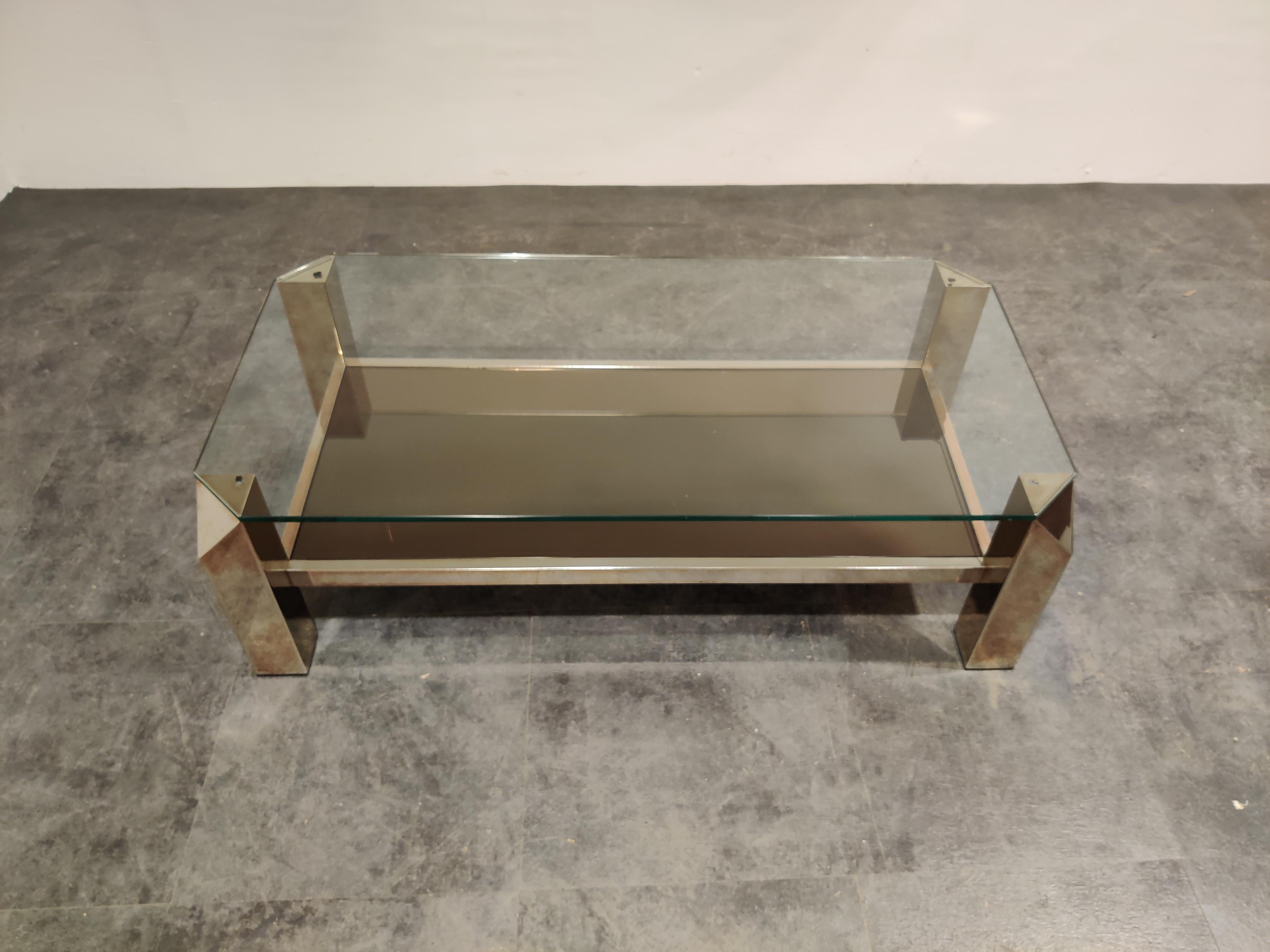 Quality 24-karat gold layered and thick clear glass coffee table manufactured by Belgochrom.

Belgochrom produced quality furniture pieces with a luxurious appeal.

Good condition, some minor fading. 

1970s, Belgium

Dimensions:

Height