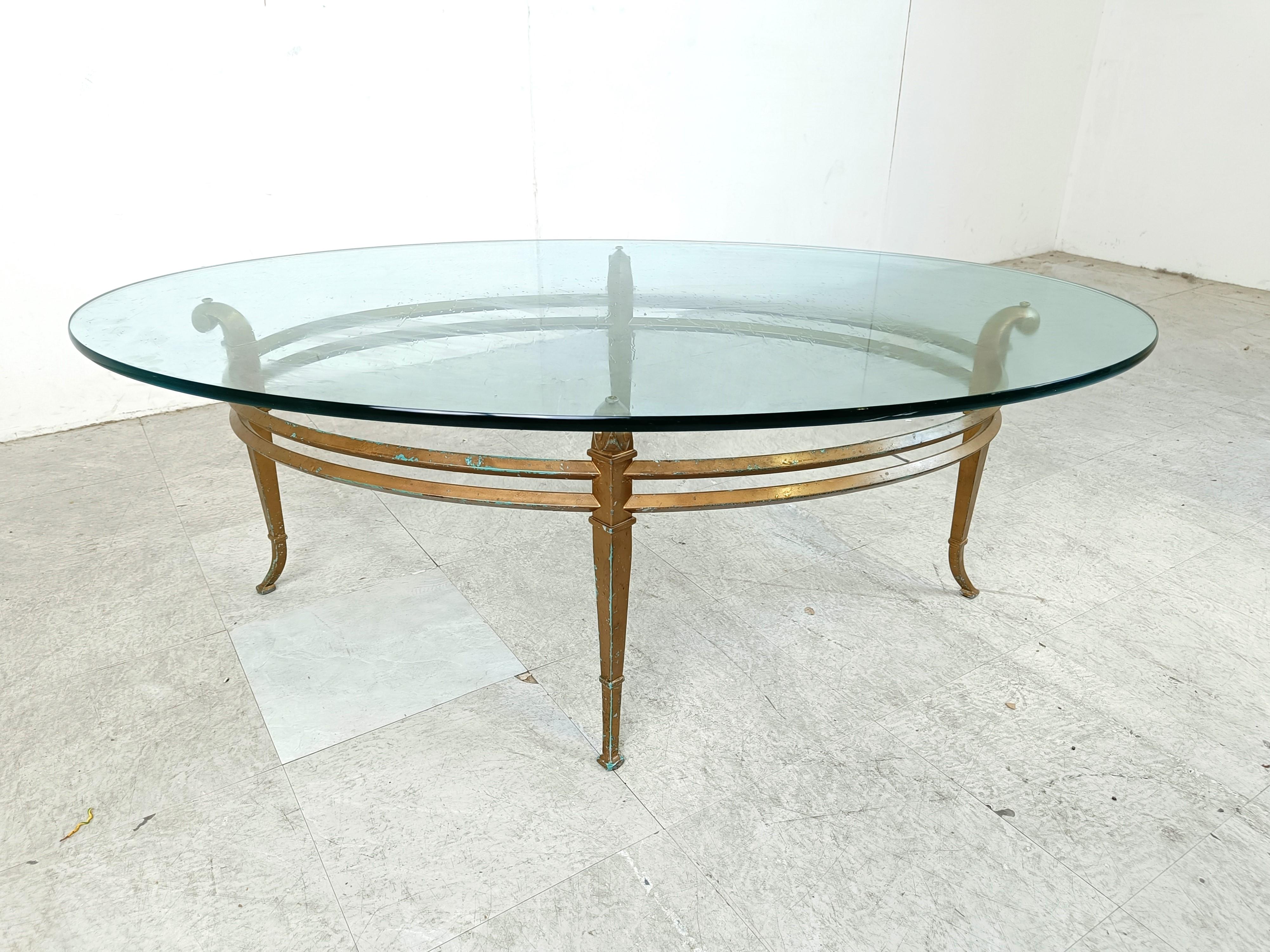 Vintage golden metal and oval glass coffee table, 1970s In Good Condition For Sale In HEVERLEE, BE