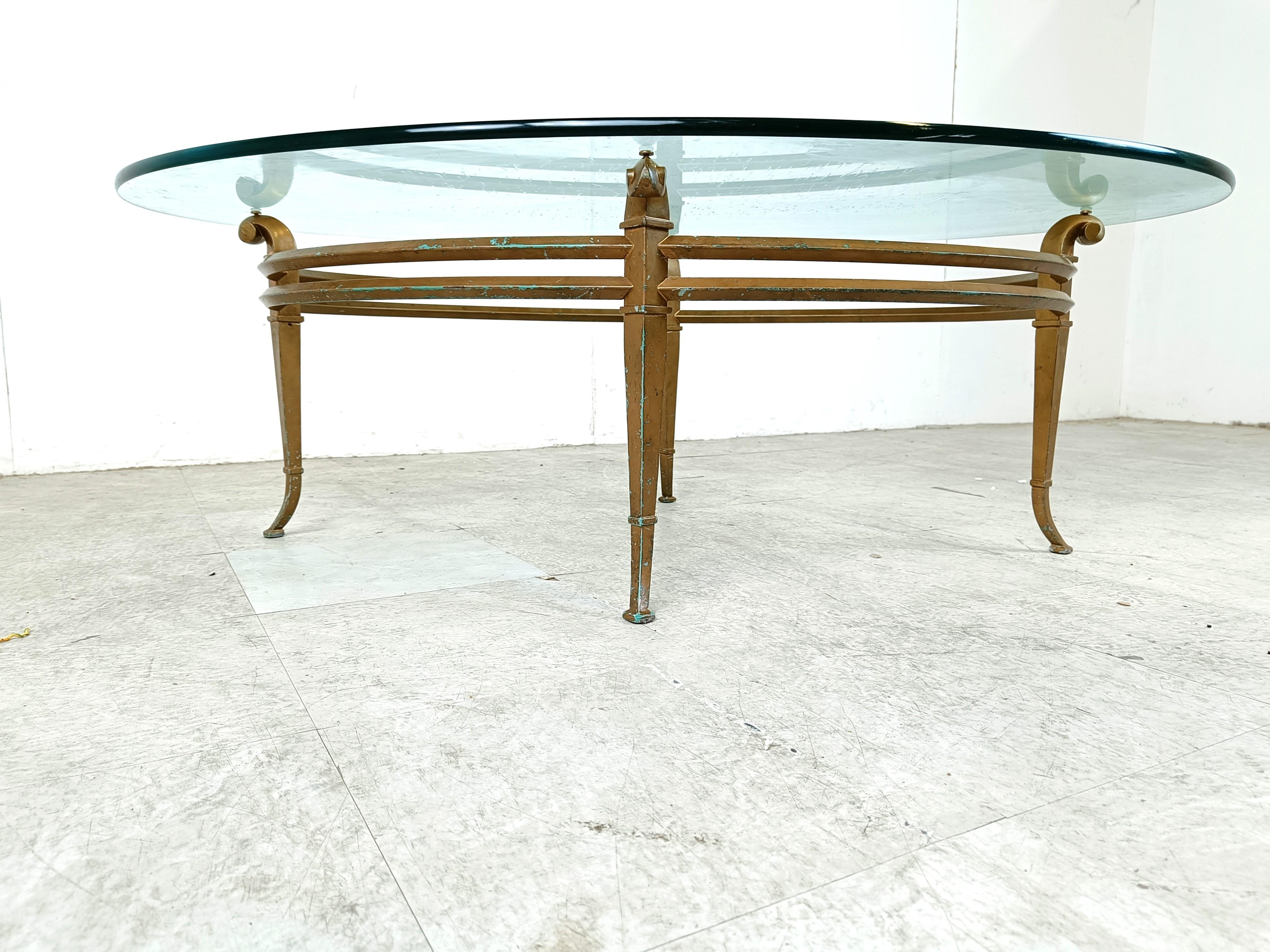Brass Vintage golden metal and oval glass coffee table, 1970s For Sale