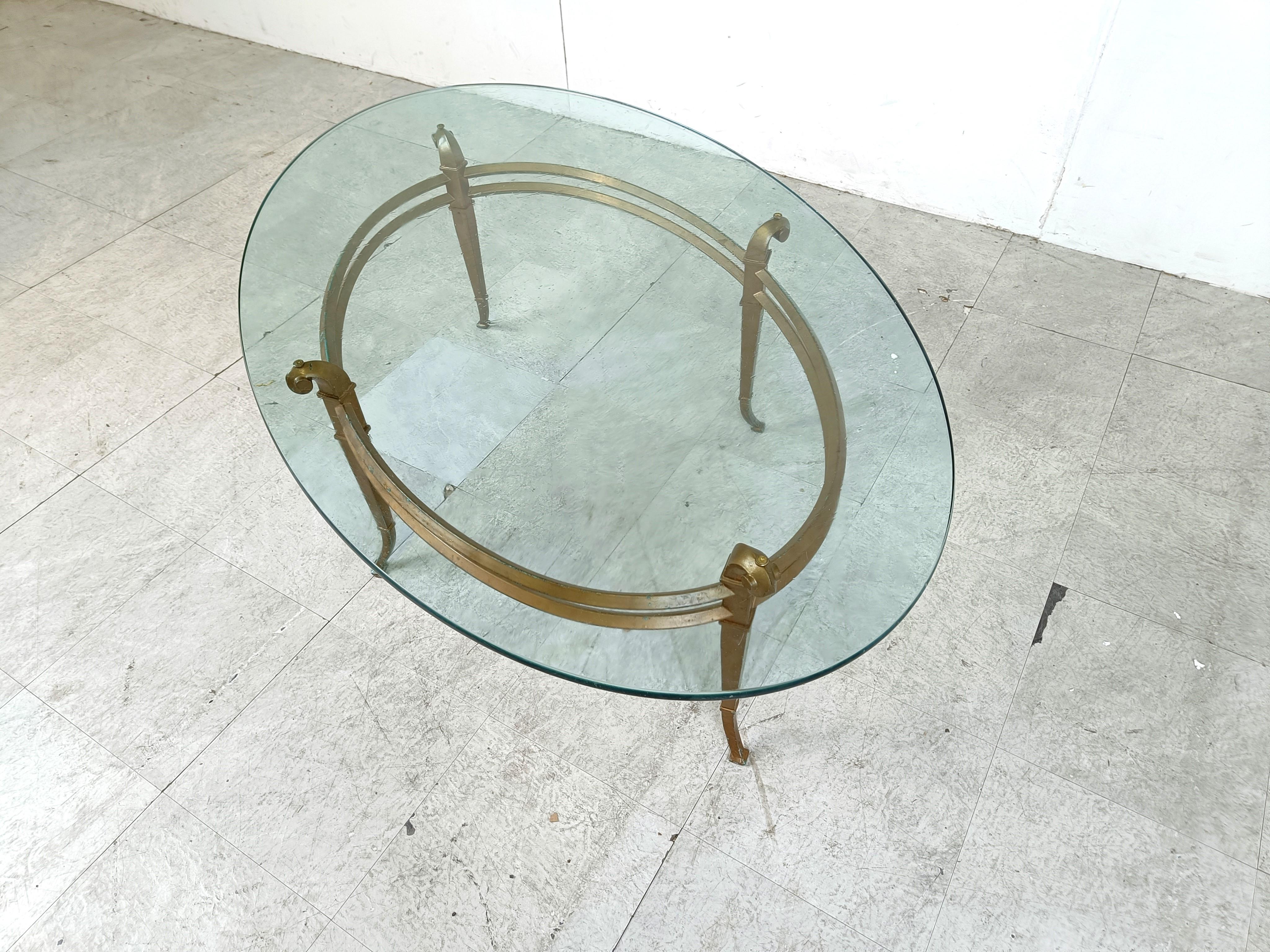 Vintage golden metal and oval glass coffee table, 1970s For Sale 1