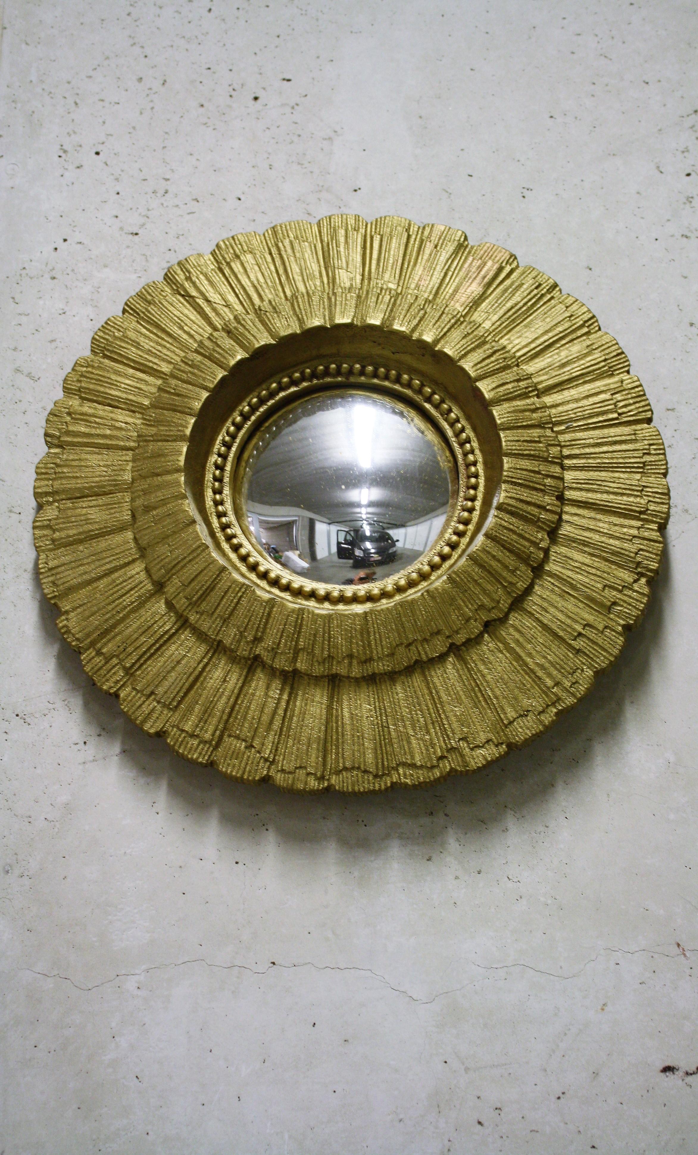 Gilded resin sunburst mirror with convex mirror glass.

The golden mirror is in a very good condition.

Great as a single piece or to add to a collection to fill the wall!

1960s, France

Pristine condition.

Dimensions:

Diameter: