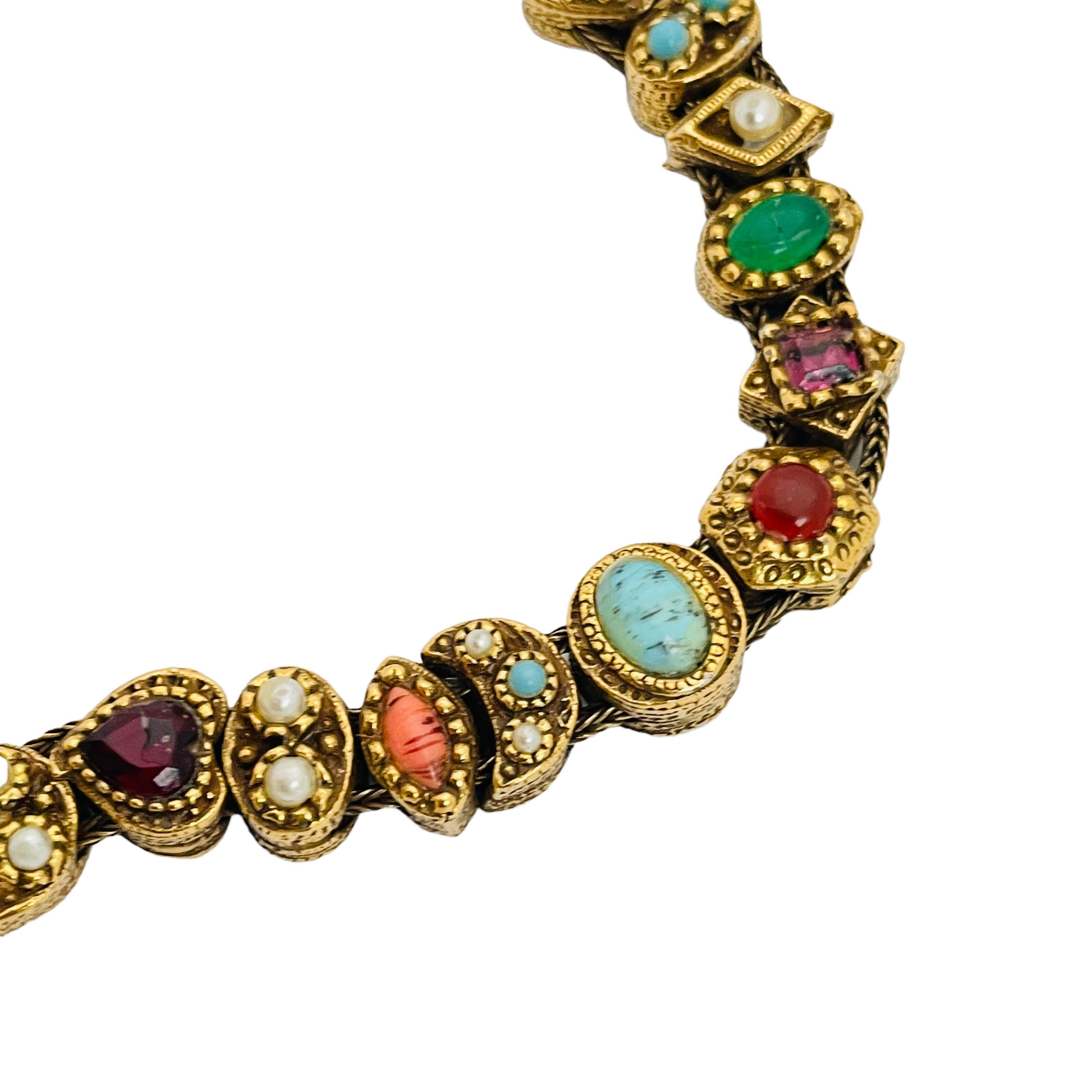 DETAILS

• signed GOLDETTE

• gold tone with glass stones

• vintage designer runway bracelet 

MEASUREMENTS

• 7.25