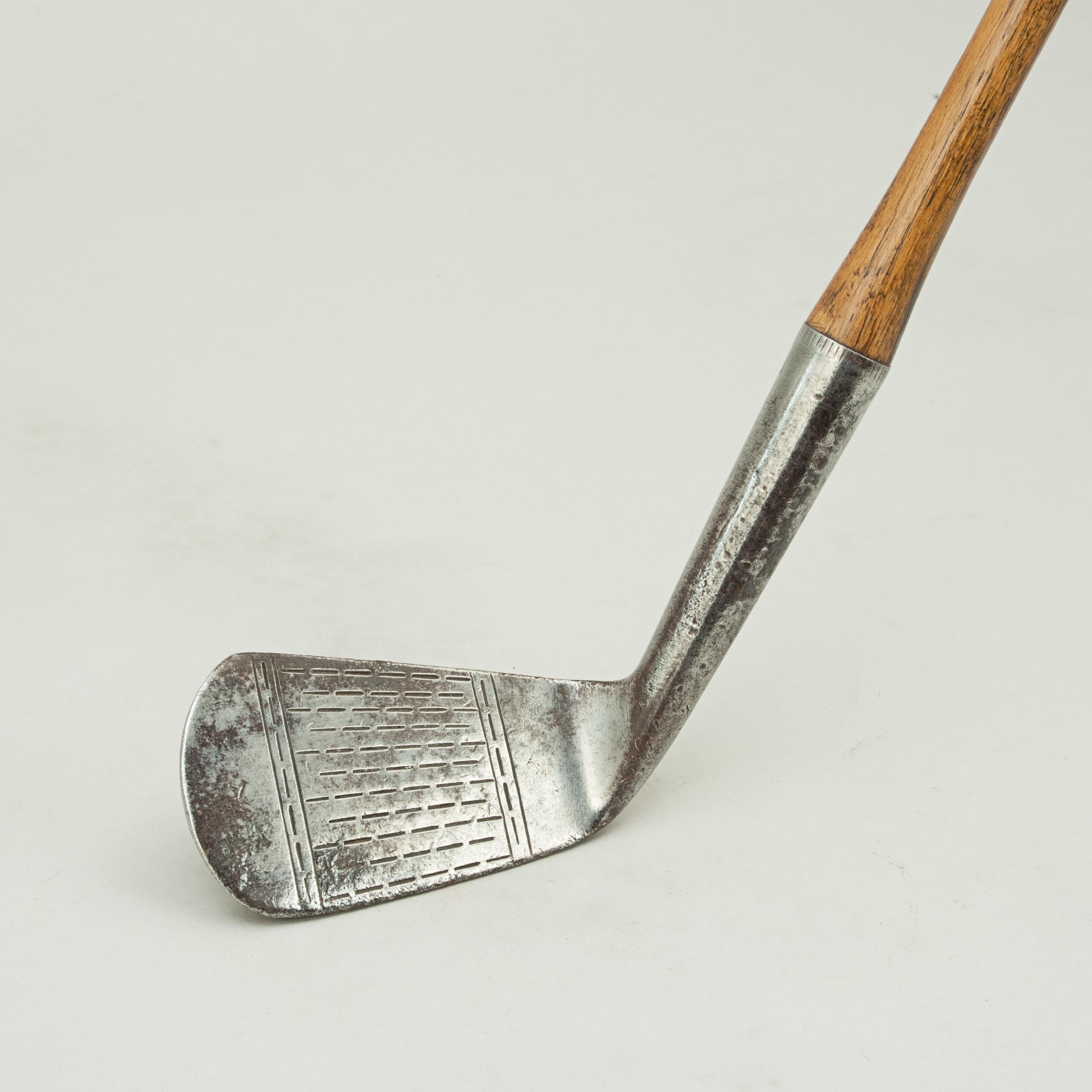 Vintage Hickory Golf Club, Deep Face Mashie, Chestney.
A good hickory shafted deep face mashie golf club by Henry Chestney. The club is with suede leather grip and could be used to play hickory golf with. The club head is with hyphen or dash face