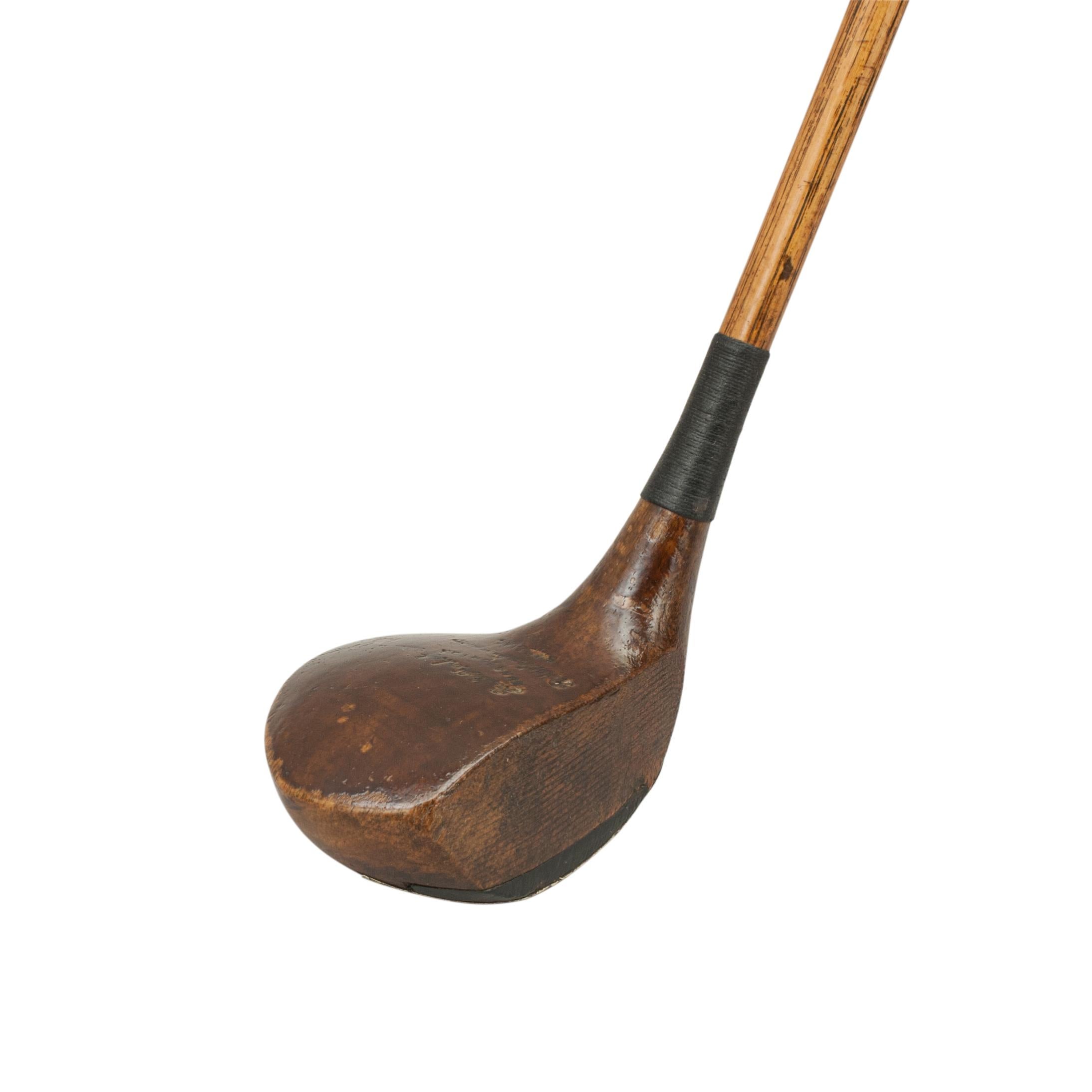 Hickory shafted socket head golf club, brassie, spoon
This persimmon wood brassie is a great playable golf club with a hickory shaft and polished leather grip. The head is marked with the golf pro's details but it is hard to decipher. The club head