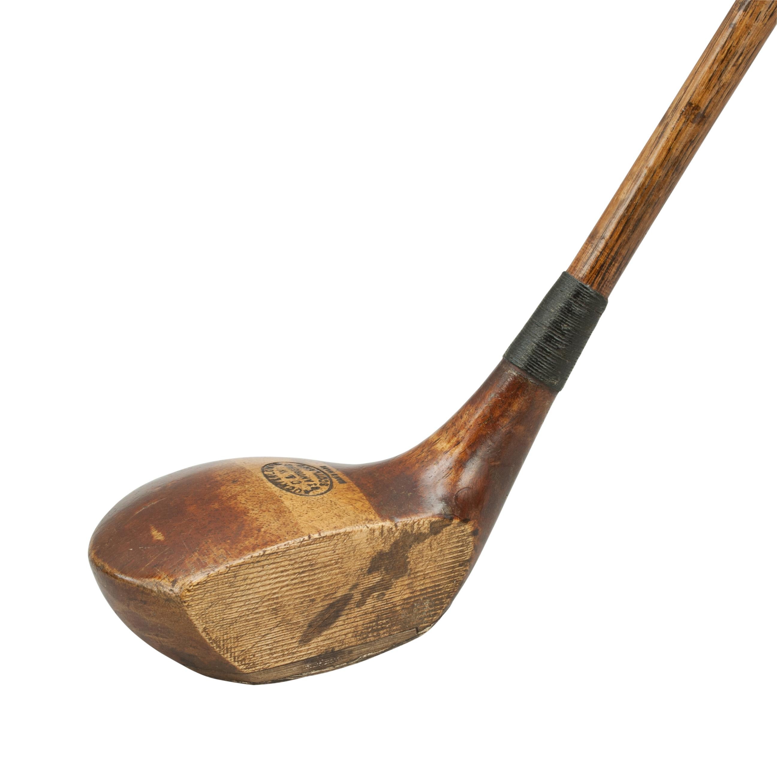A good original persimmon wood golf club, driver by Auchterlonie of St Andrews. The club head is stamped 'D. & W. Auchterlonie, Scotland, handmade'. The head with lead weight to the rear with a Horn sole insert on the leading edge and partial brass
