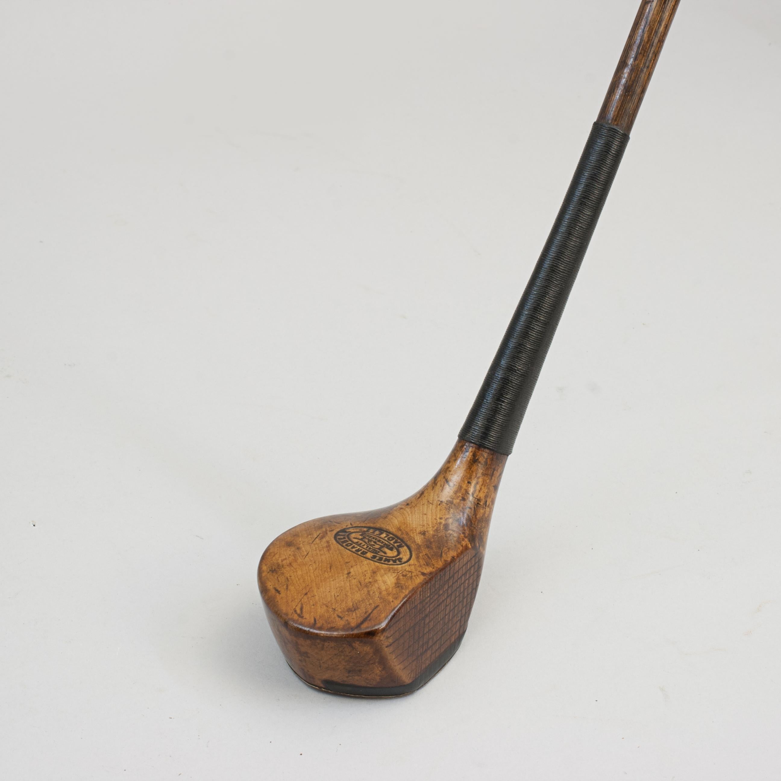 Antique Golf Club, Scared Head Brassie
A nice original beechwood head golf club with hickory shaft and sheepskin grip. The scared head club with traditional horn slip along the leading edge of the sole, full brass sole plate and lead weight to