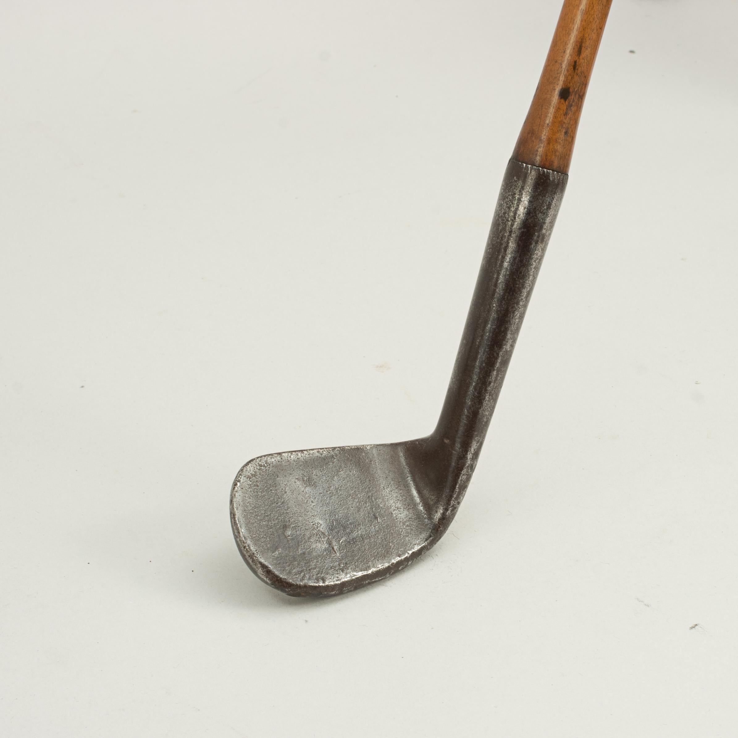 Hickory Shafted Army & Navy Rut Iron.
A rare good quality early smooth faced rut iron, also known as a rut niblick, rutter or track iron. Rut irons were commonly used to hit the ball from cart tracks and deep ruts etc. Young Tom Morris was known to