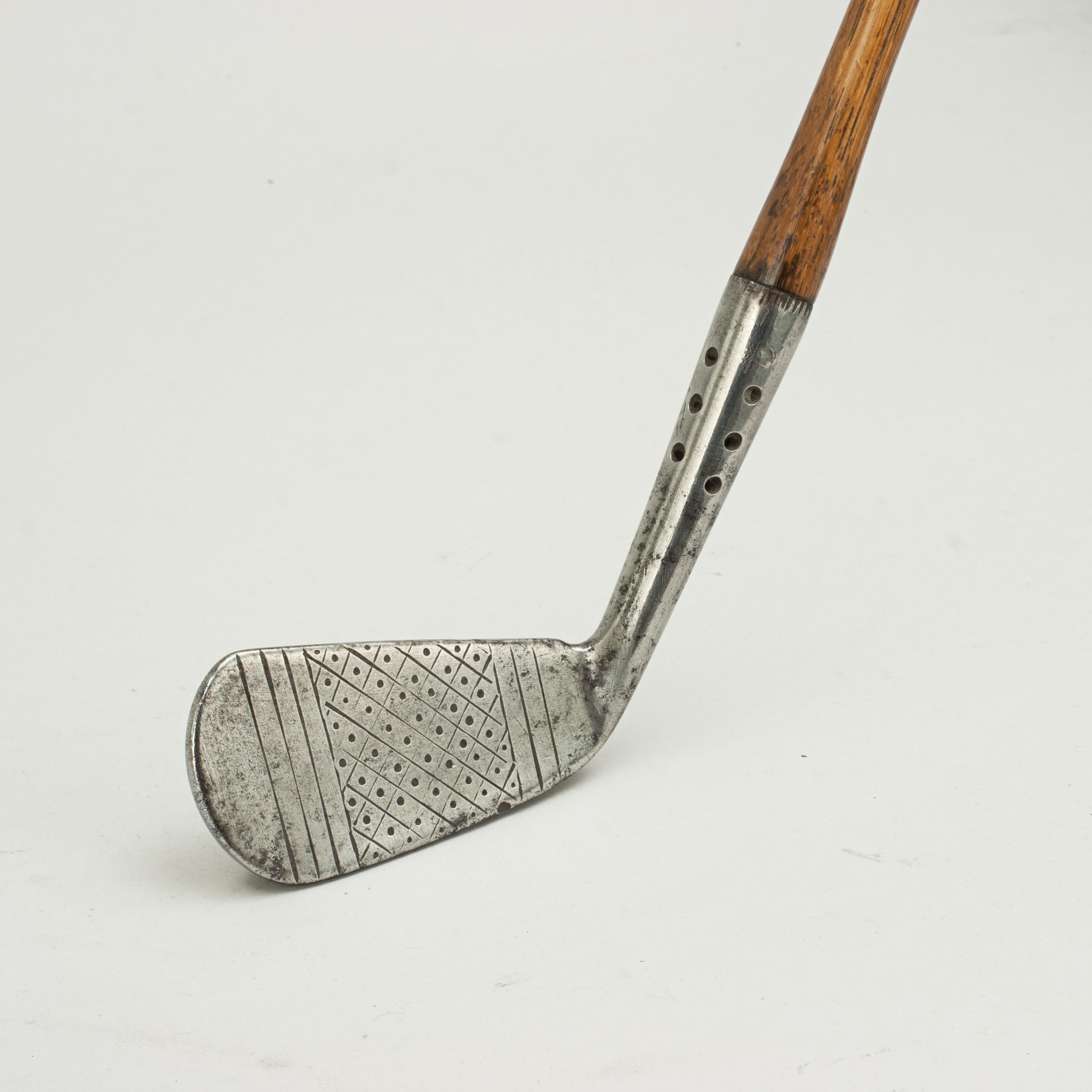 Playable Hickory Golf Club.
A good golf club, Maxwell Iron by J. Anderson of St Andrews. The Iron with a Maxwell design hosel, this is where the hosel is drilled with holes so the extra weight can be put into the flanged sole for extra weight and