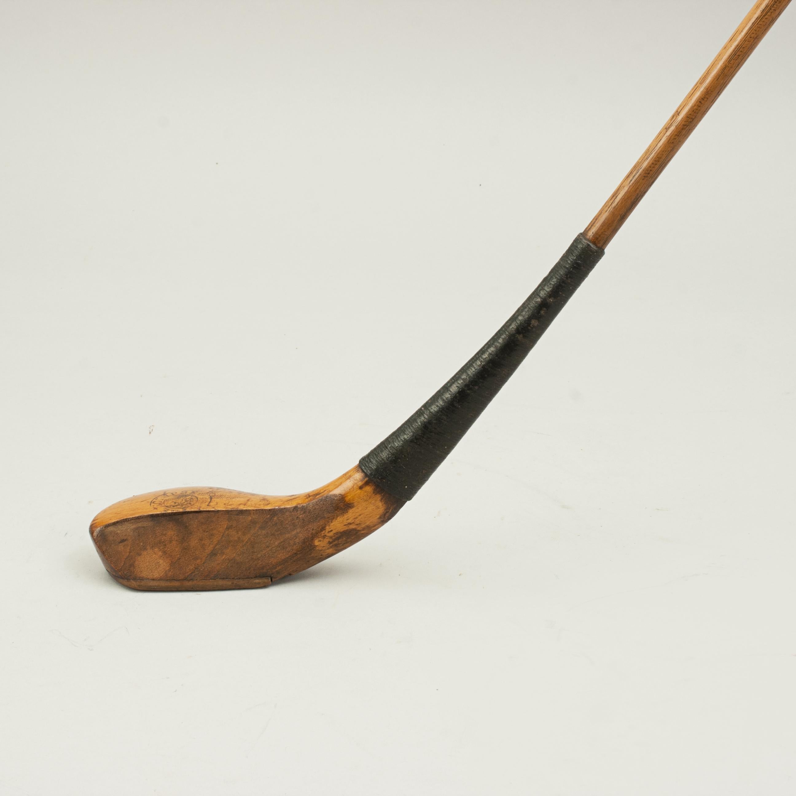 Antique Scared Head Long Nose Golf Club.
A long nose lofted club in great condition, maker unknown. The golf club has a blond beech-wood head with lead weight to the rear, traditional horn slip along the leading edge of the sole, head stamped 'The