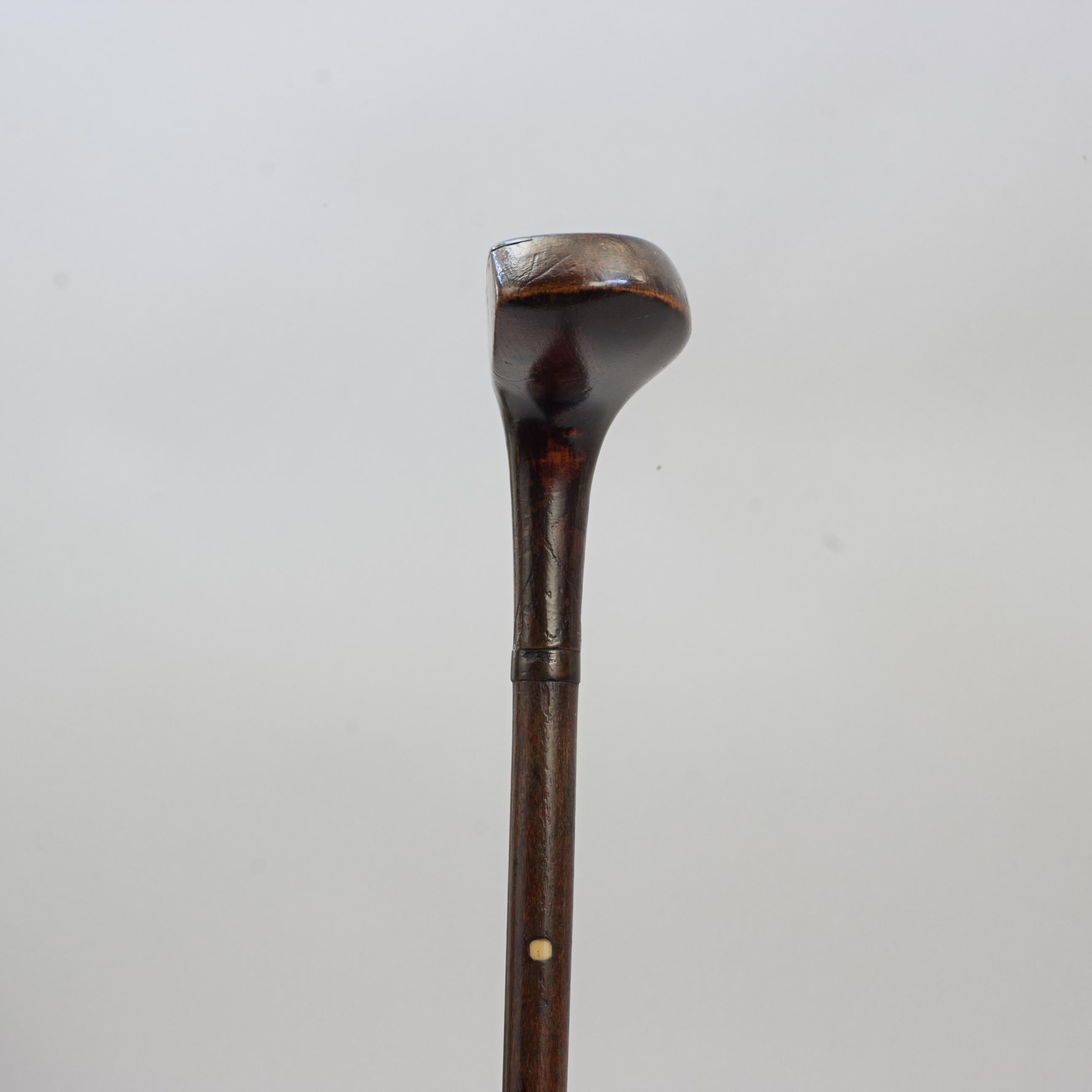 Antique Sunday Club, Golf Club Walking Stick.
A desirable walking cane with the handle in the shape of a golf club head. The gentleman's walking stick has a persimmon socket head handle with a small pegged horn insert. It is with hickory shaft with
