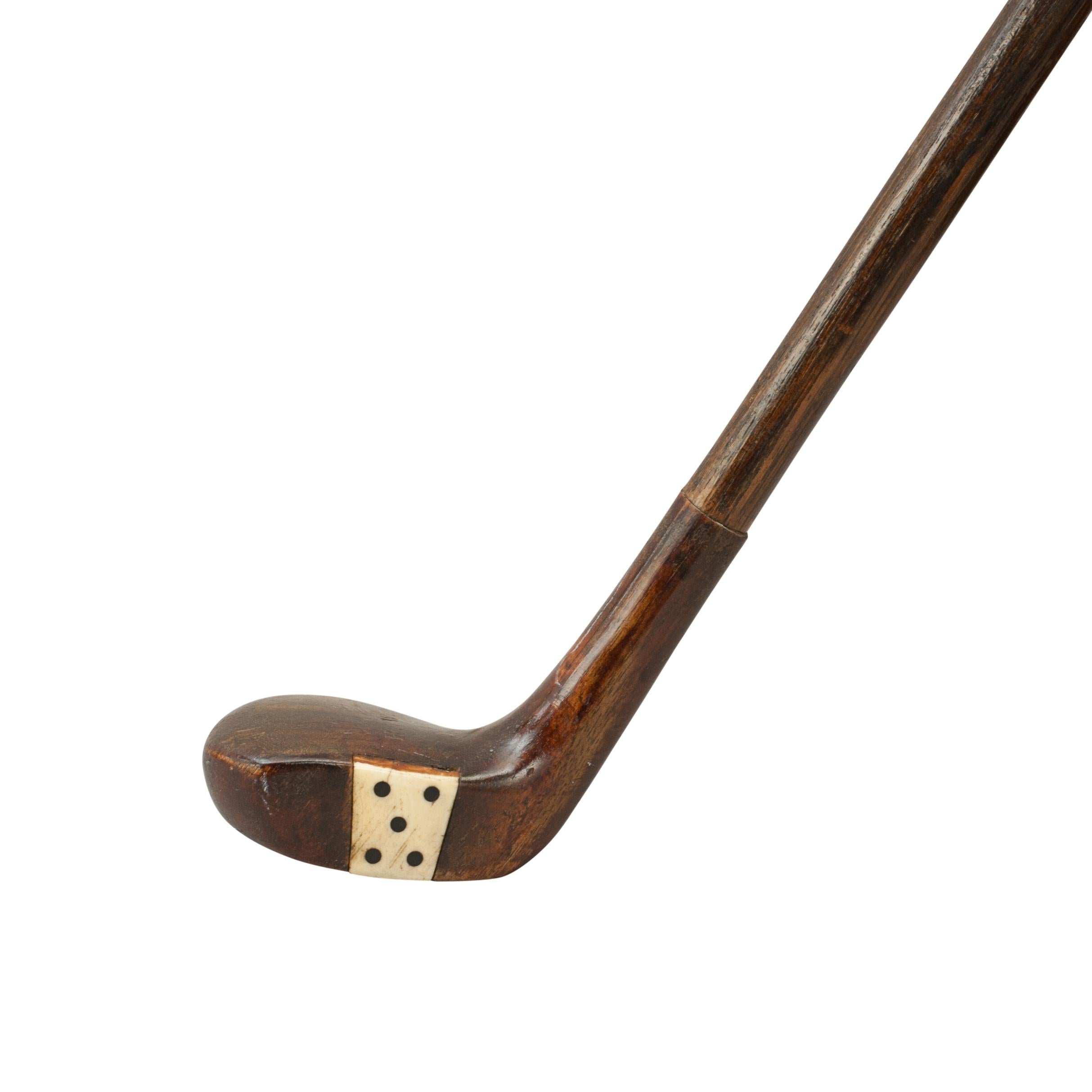 Antique Sunday Club, Golf Club walking stick.
A desirable walking cane with the handle in the shape of a golf club head. The gentleman's walking stick has a persimmon club head with a pegged horn insert and a lead weight to the rear as the handle.