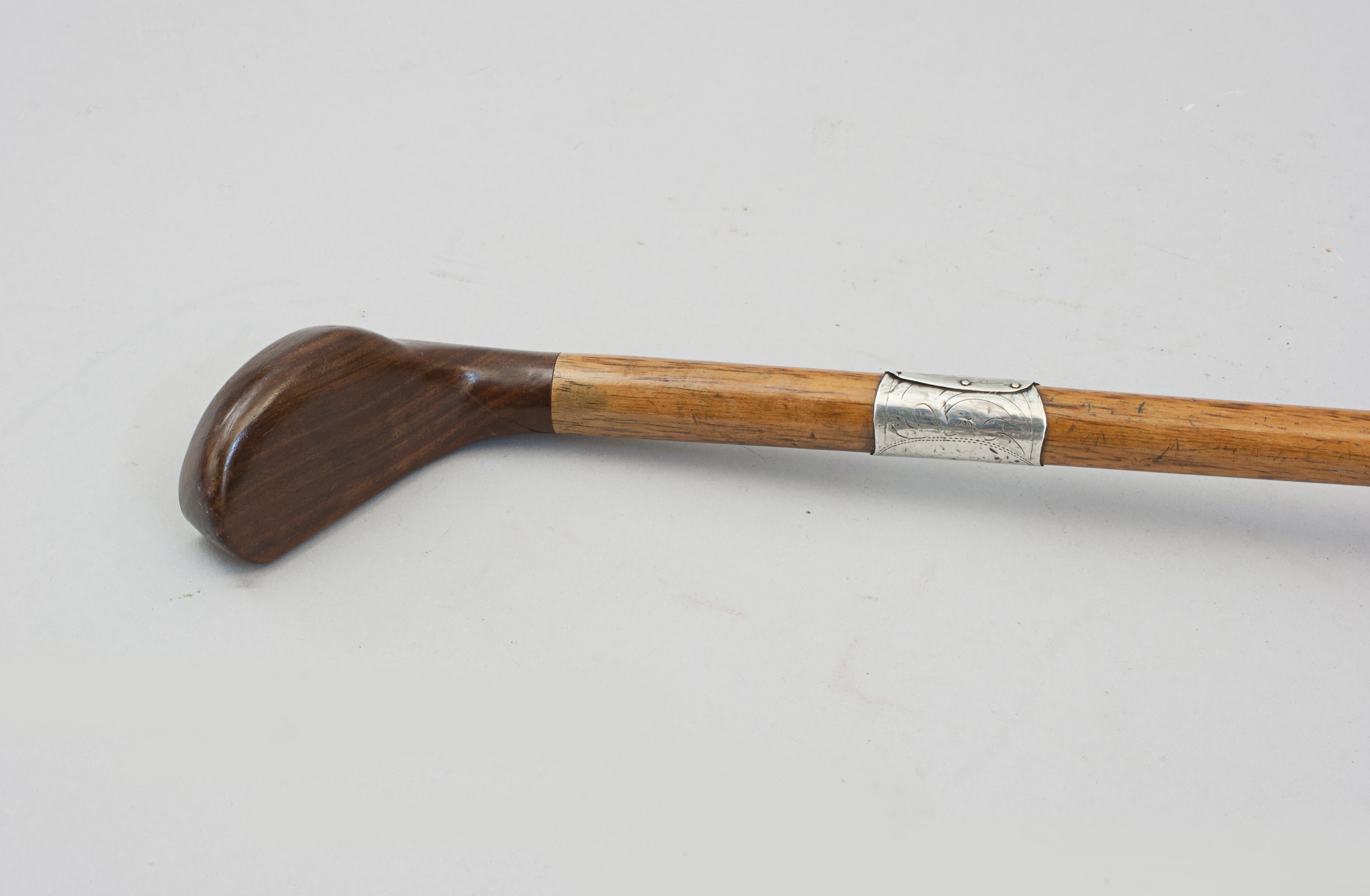 Antique Sunday Club, Golf Club Walking Stick.
A desirable walking cane with the handle in the shape of a golf club head. The gentleman's walking stick has a persimmon socket head handle with a pegged horn insert. It is with hickory shaft with a