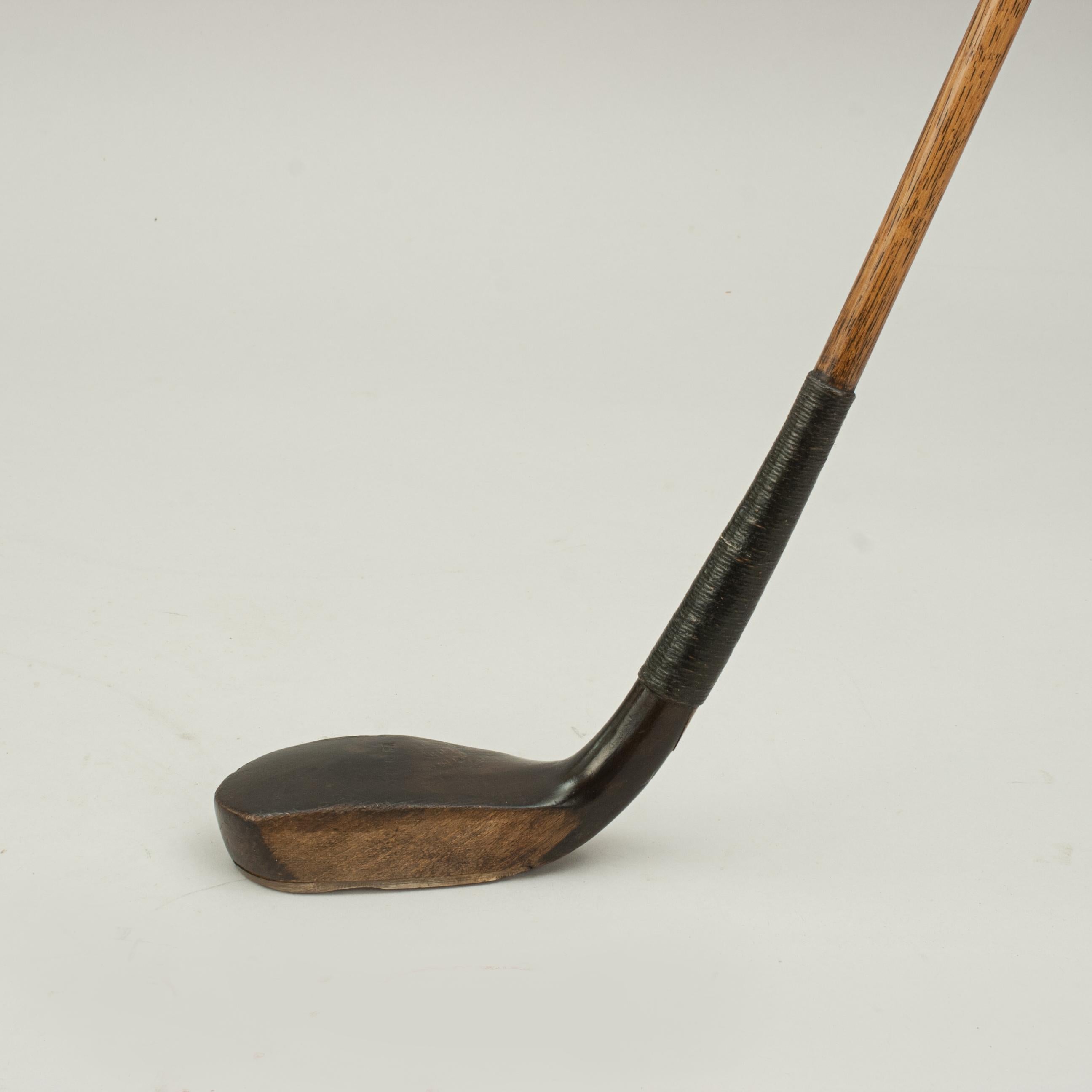 Antique scared head putter, Charlie Hunter.
A good long nose style putter by Charlie Hunter, Prestwick. The golf club has a lead weight to the rear, traditional horn slip along the leading edge of the sole, the stained polished beech wood head