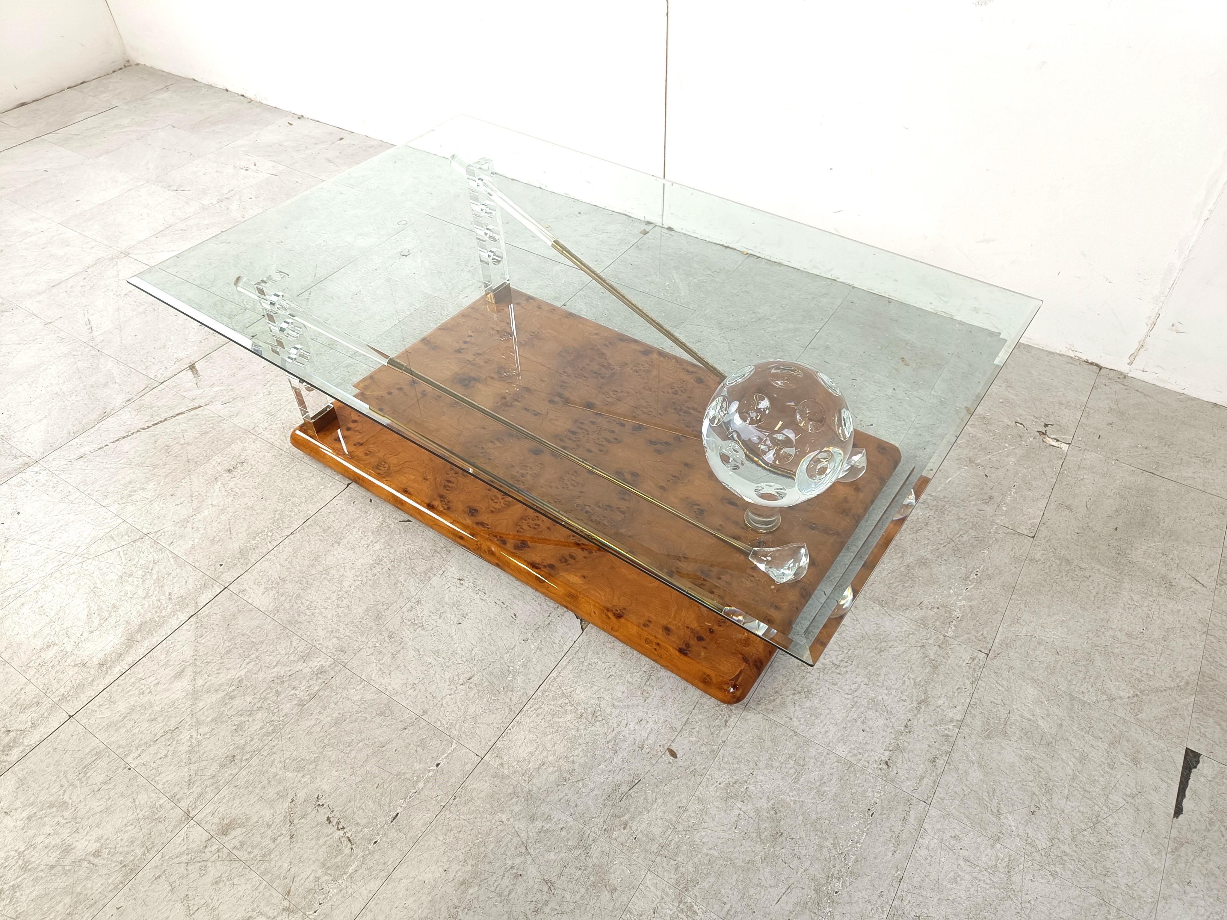 Exclusive and very rare golf themed coffee table.

Made with a burl wood base, supporting a lucite and brass golf ball and clubs and finished with a clear beveld rectangular glass top.

Striking look which will be a real talking point in your living