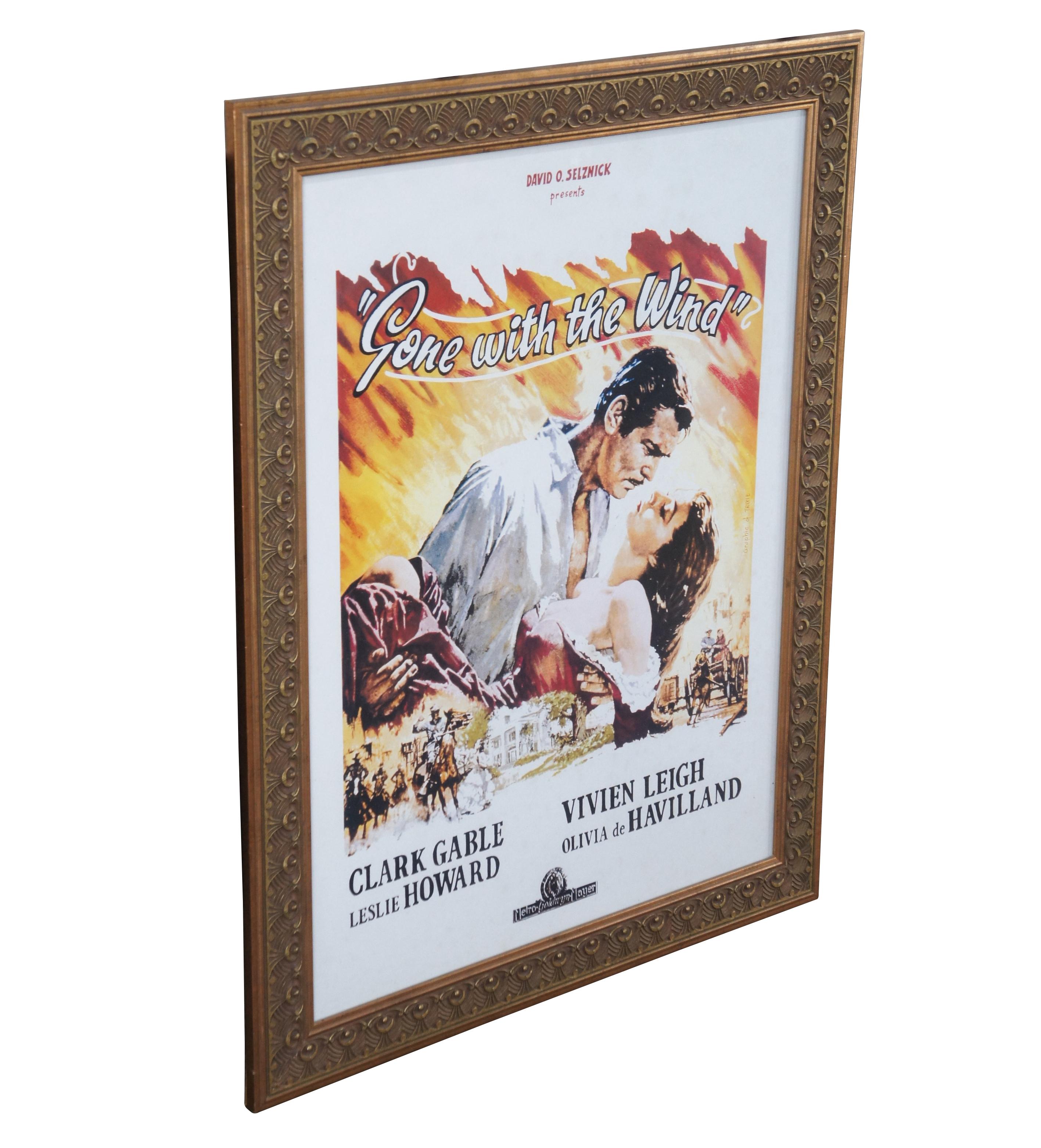 Vintage Gone with the Wind movie ad poster, framed in ornate art deco style gold frame.

David O. Selznick presents, Gone with the Wind, starring Clark Gable, Leslie Howard, Vivien Leigh, and Olivia de Havilland, Metro Goldwyn Mayer, Graphic of