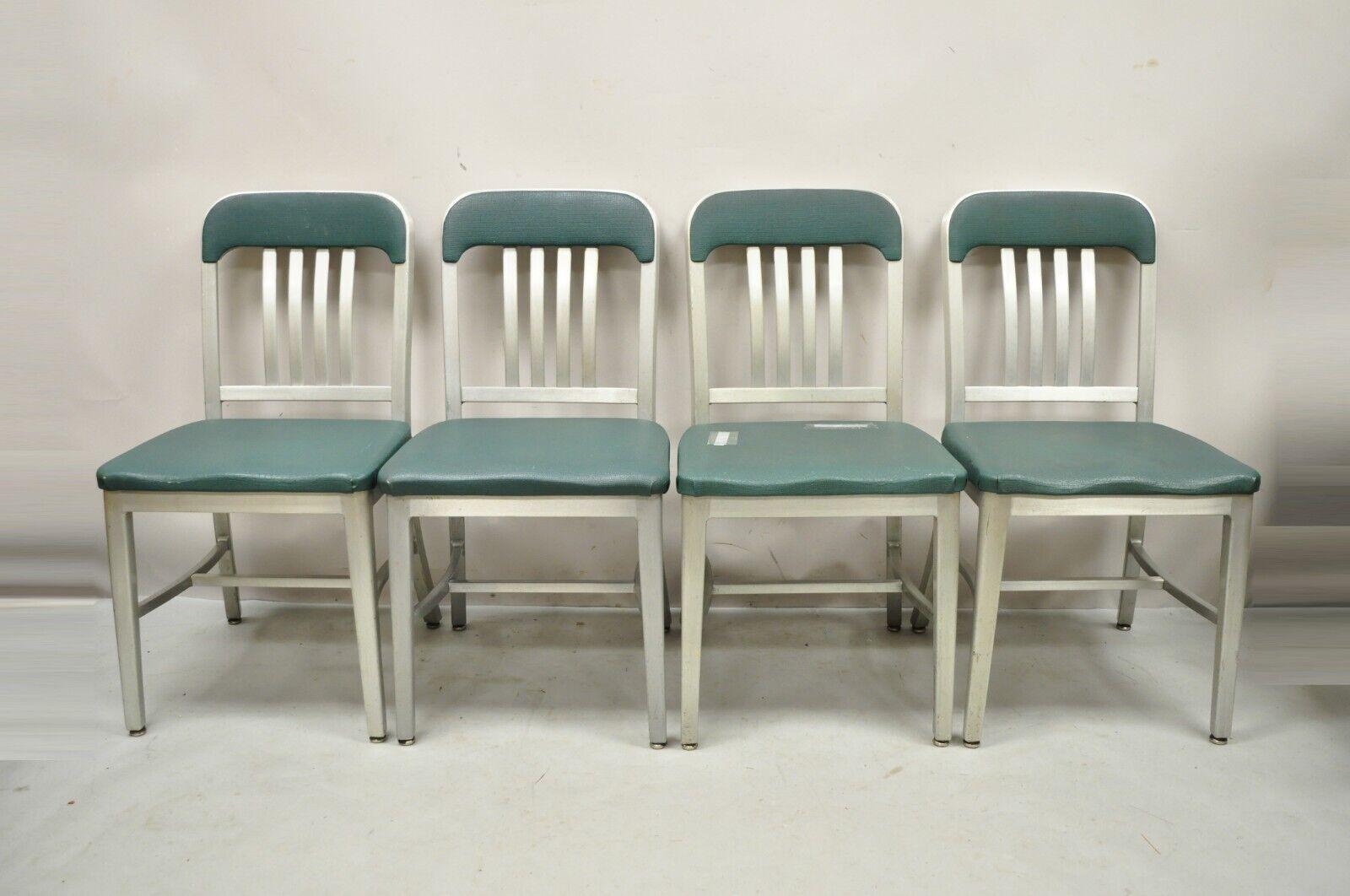 Vintage Good Form Aluminum Frame Green Vinyl side chairs - Set of 4. Item features green vinyl back and seat, original label, aluminum frames, great vintage set. Circa Early to Mid 20th Century. Measurements: 34