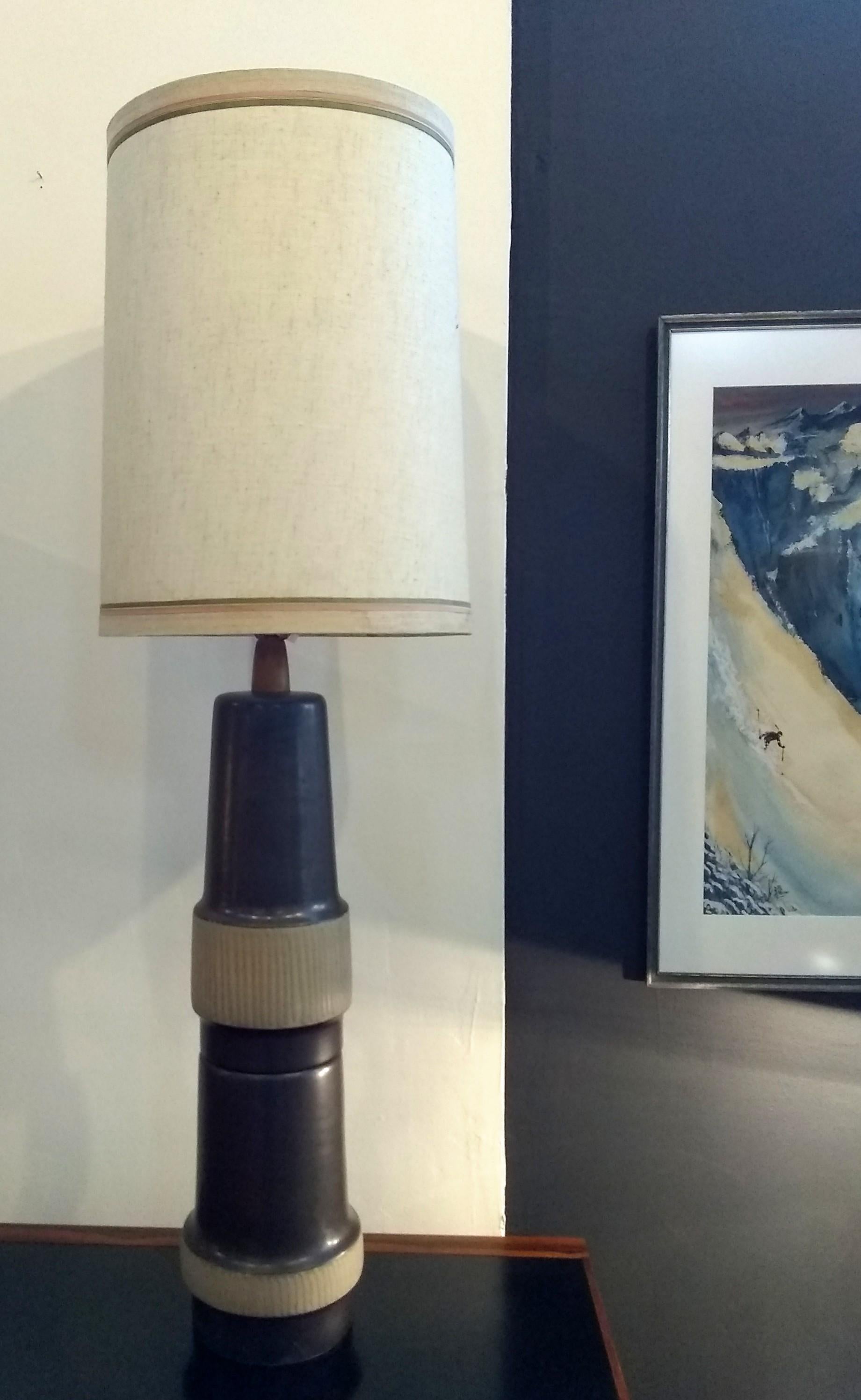 This amazing, soaring table lamp was designed by Gordon & Jane Martz and manufactured at their Marshall Studios facility in Veedersburg, IN.  A wonderful example of handmade modernist studio ceramics.

Non-original shade and finial, priced
