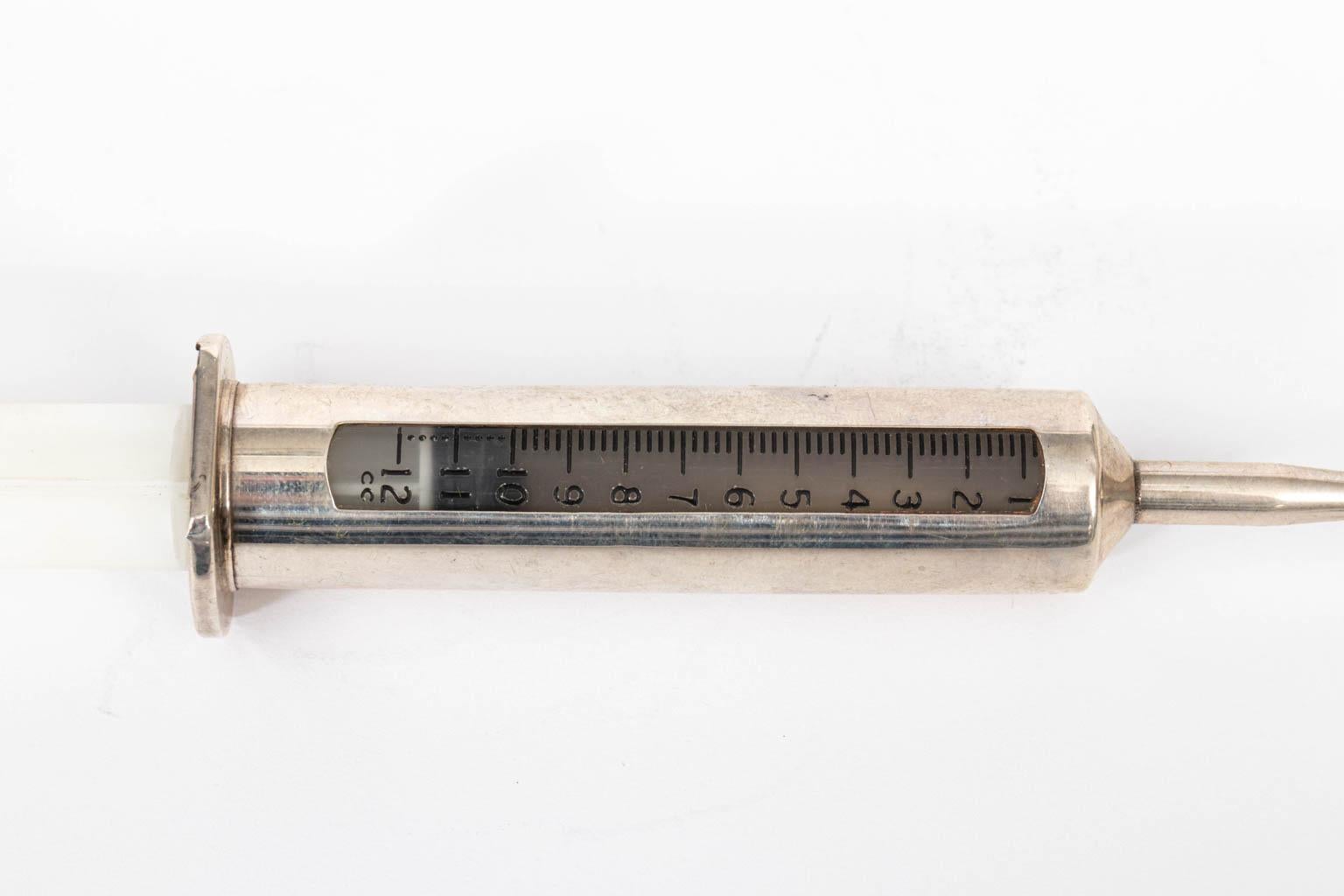 Vintage sterling silver vermouth dispenser in the form of a syringe by Gorham, circa 1960s. These were called 