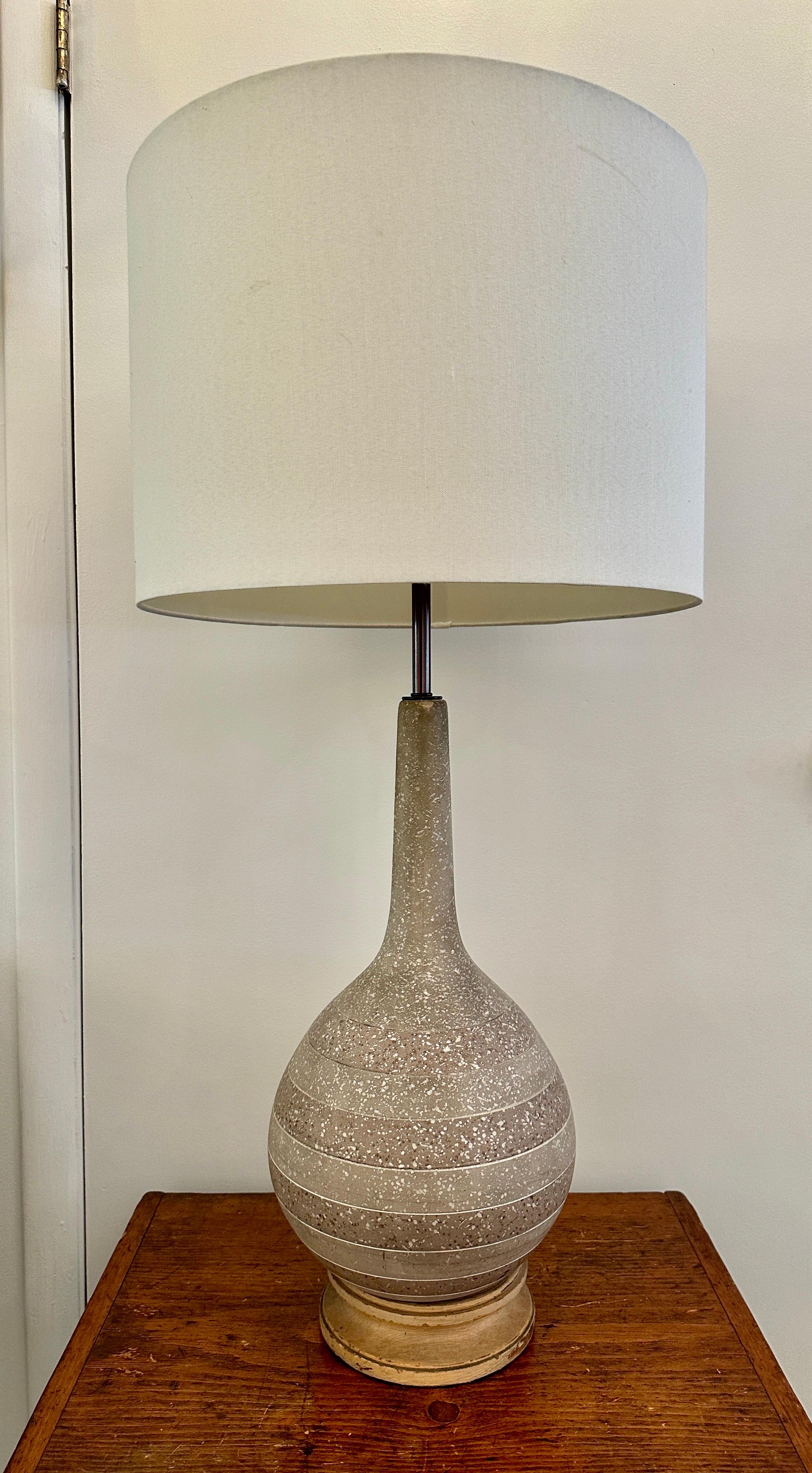 Two-tone striped and speckled ceramic gourd shaped table lamp with original natural wood base.  Rewired with silk cable and double cluster sockets.