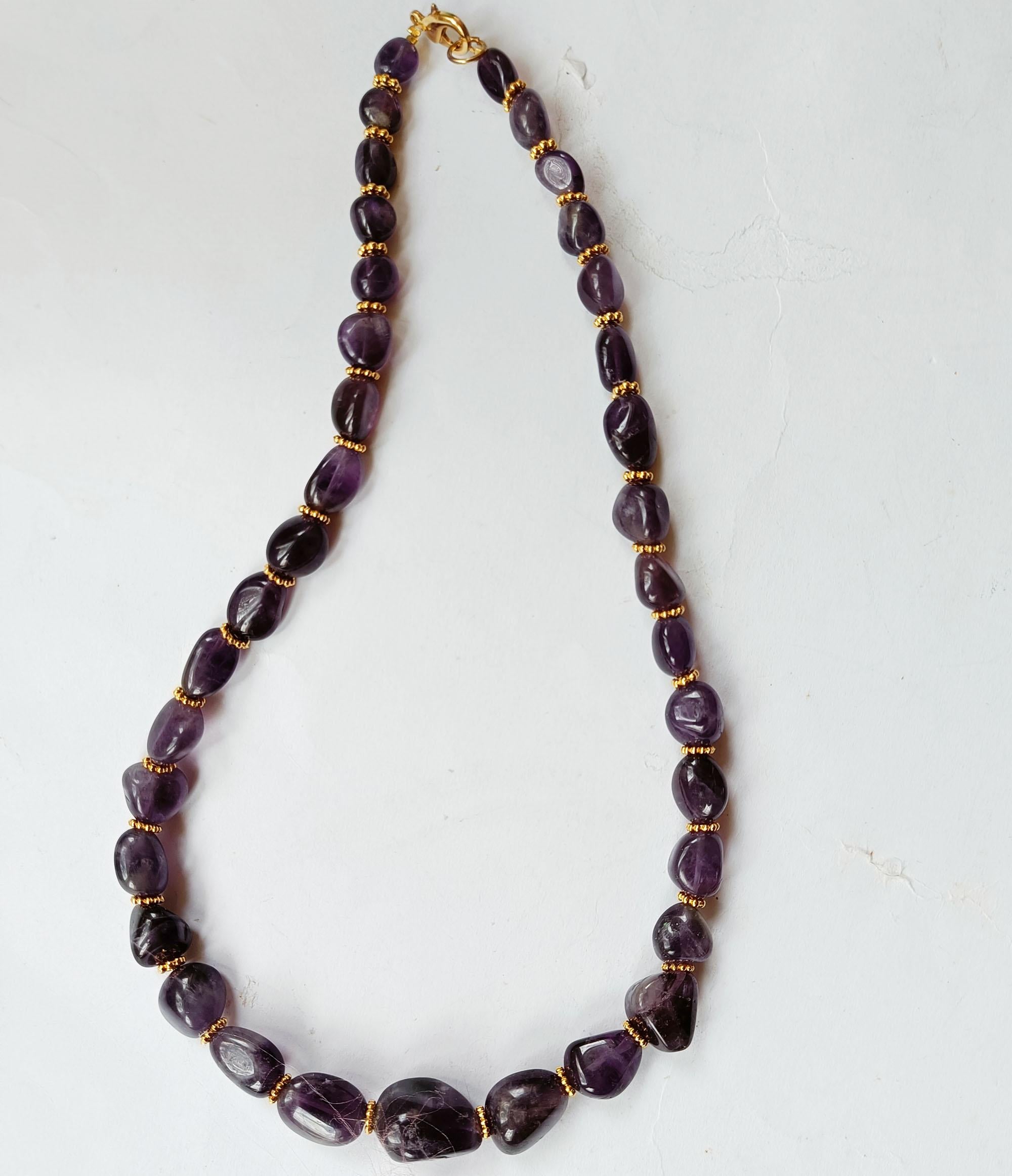 Vintage graduated Amethyst Necklace

A Very fine Vintage Amethyst Necklace made from graduated beads interspersed with small gold plated metal spacers creating sumptuous visual combination. Compare to a vintage Gucci in similar combination 




