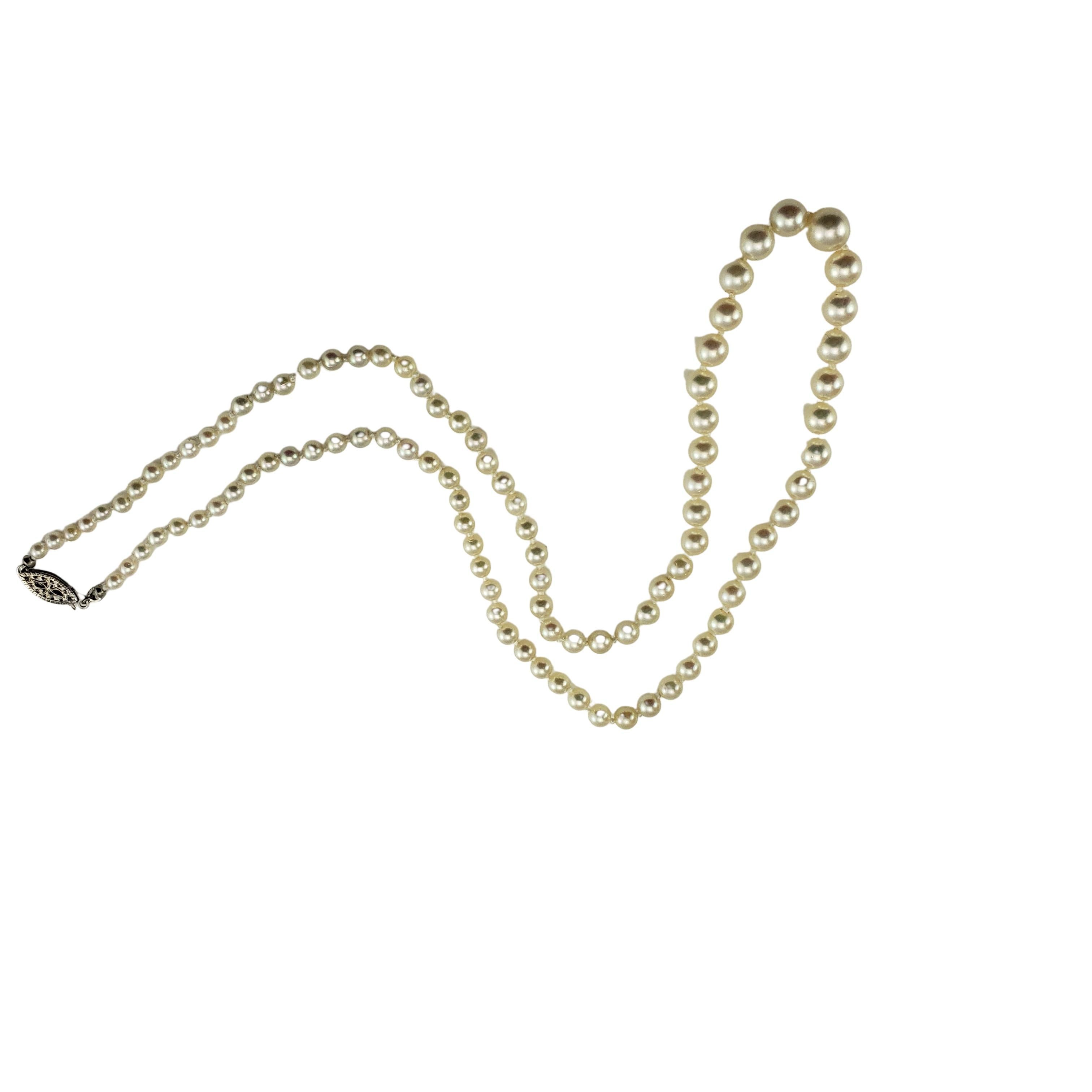 Vintage Graduated Cultured Pearl Necklace with 14 Karat White Gold Closure-

This lovely necklace features 97 graduated white cultured pearls (3 mm - 7 mm) with a classic 14K white gold closure. 
Individually knotted, just restrung.

Size: 19.5