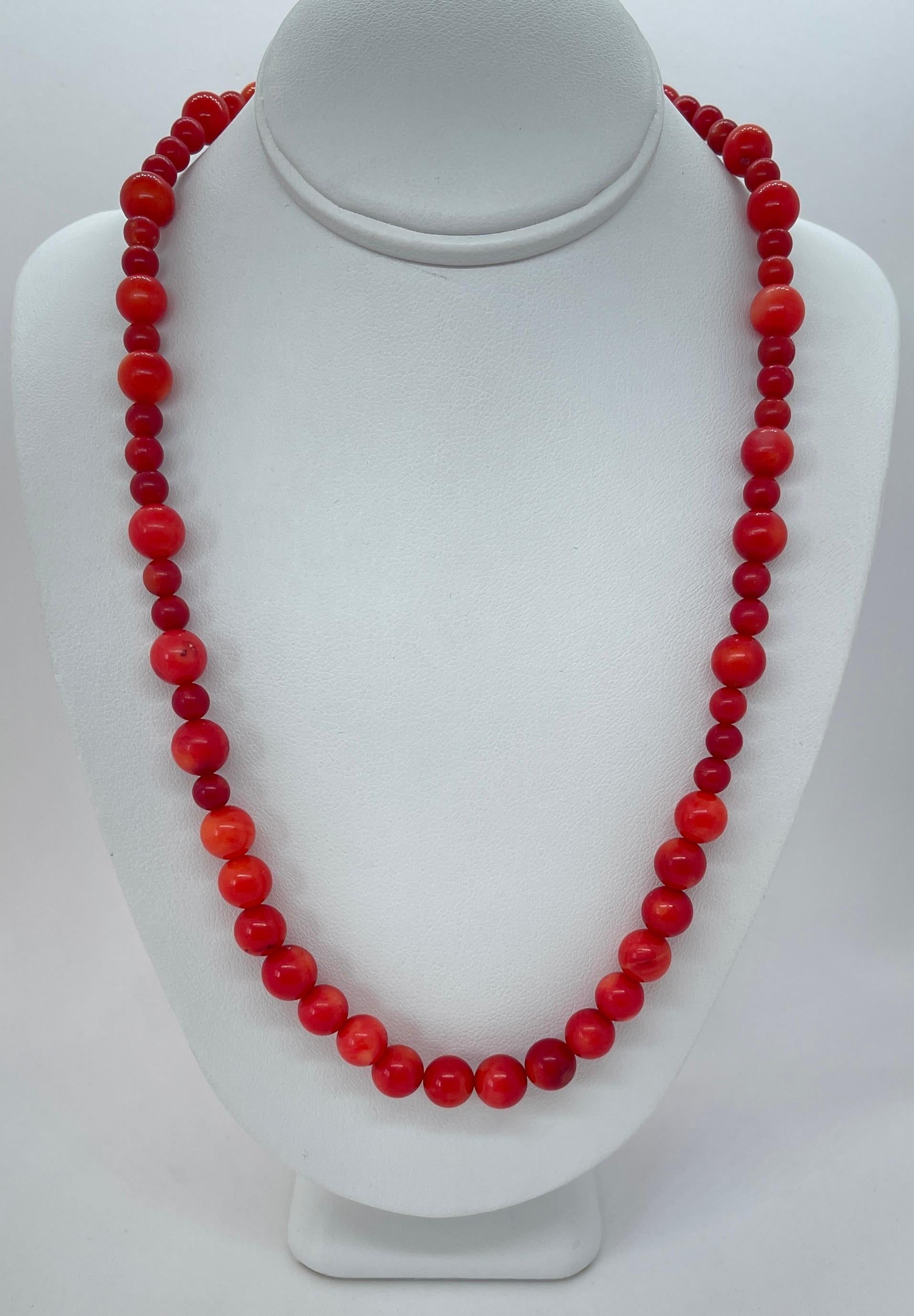 A lovely vintage Coral necklace displaying dark red to medium red tones C1950s.  
The necklace features 16 uniform beads at the front which then graduate to alternating large and small beads (see photos).  
It's approximately 80cms long and just