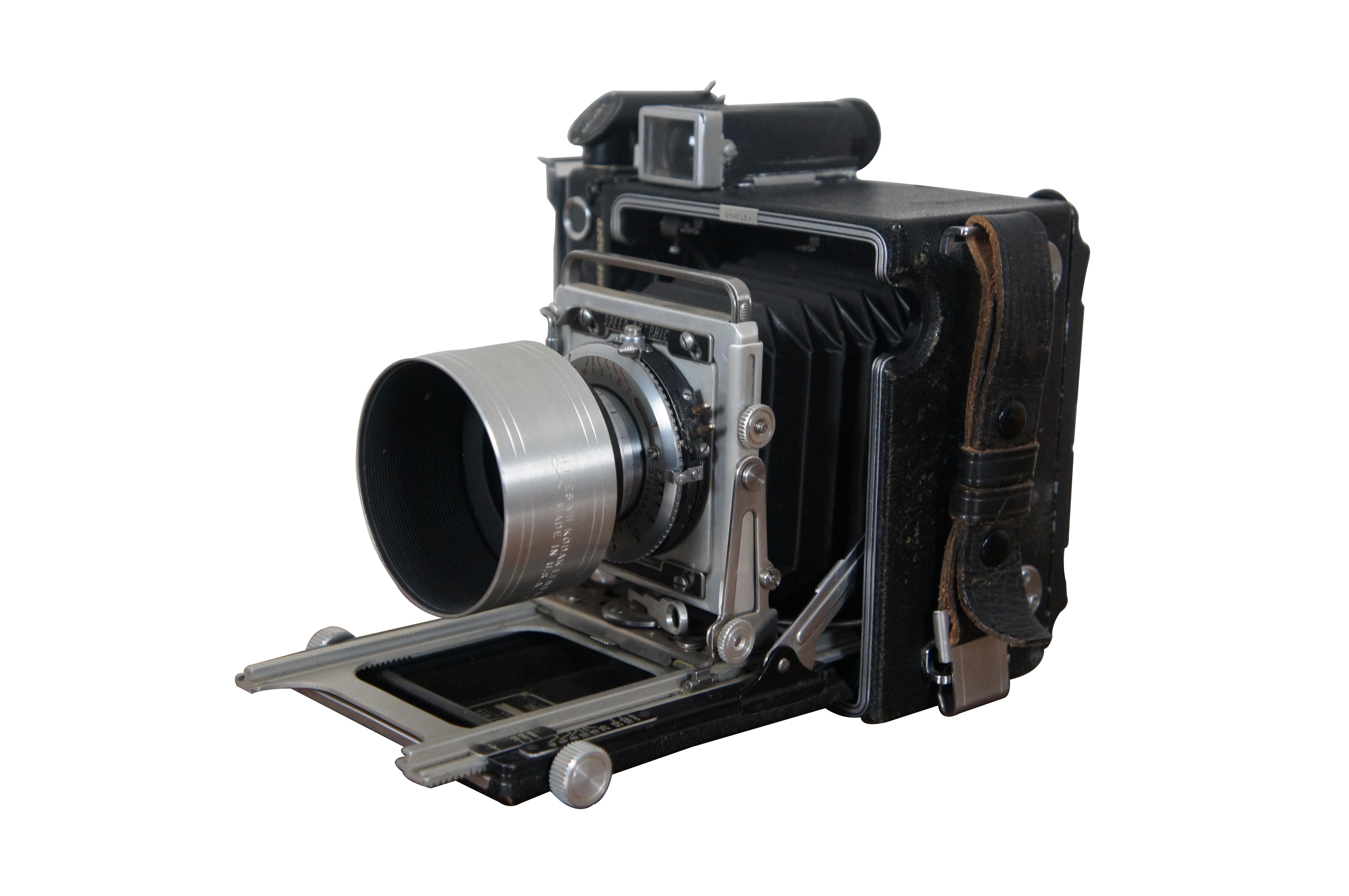 Vintage Graflex Speed Graphic camera with Kodak Ektar 3.7 105mm lens.  Comes with Kalart Focuspot sychronized range finder. Contemporary case with 2 new straps/key sets; 14 Lisco Regal 2 1/4 x 3 1/4 Cut Film Holders; 2 Graflex 