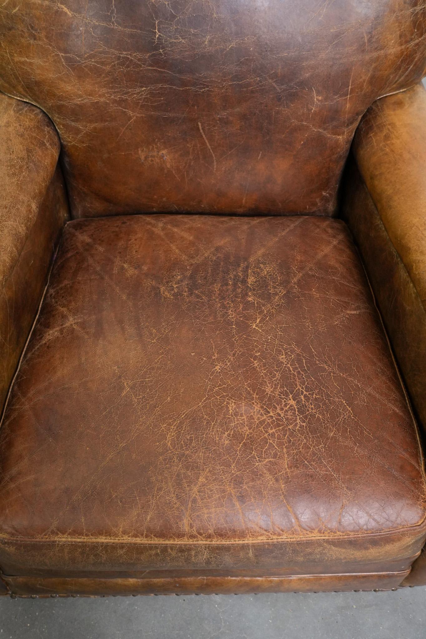 XXIe siècle et contemporain Vintage grained cowhide leather armchair with rounded shapes en vente