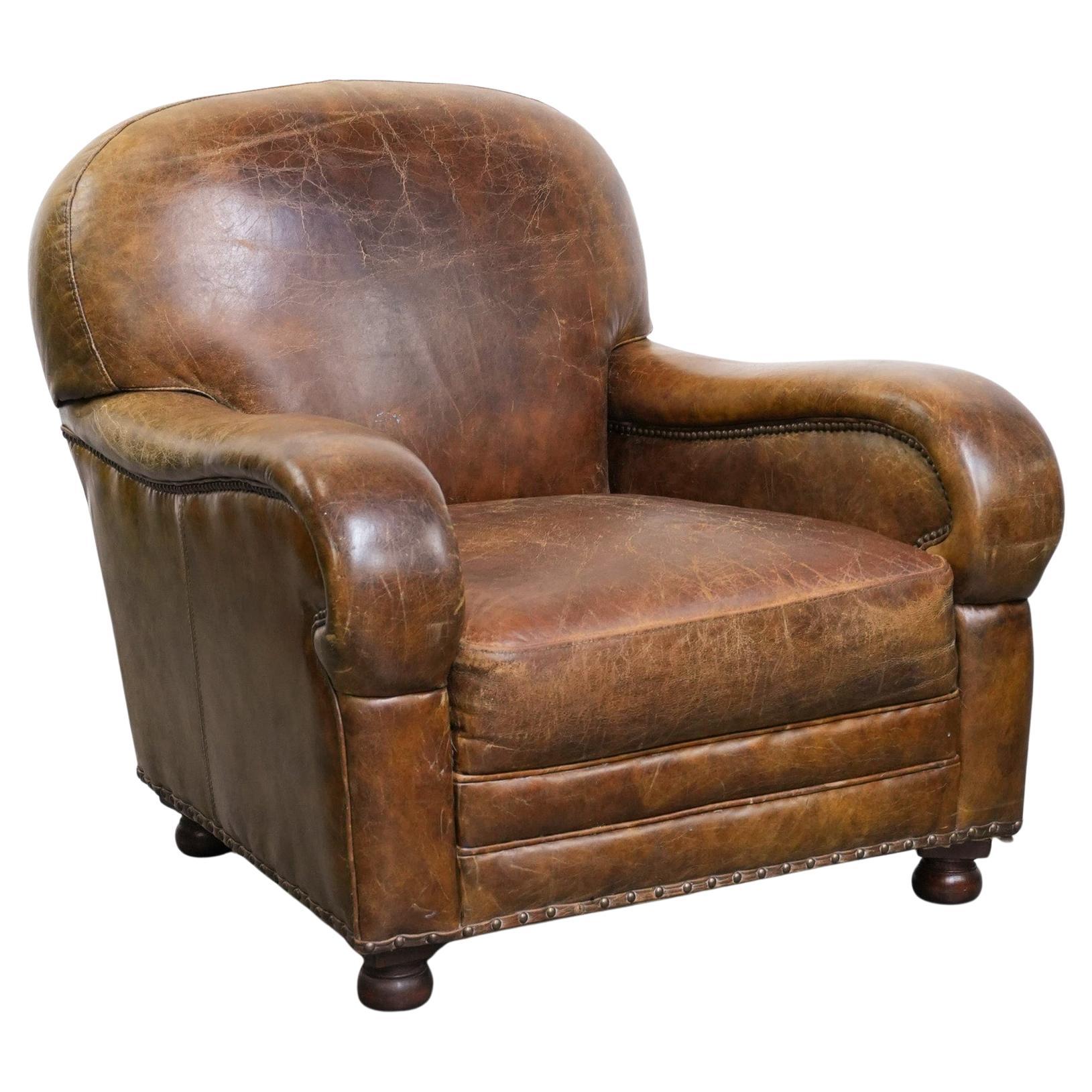 Vintage grained cowhide leather armchair with rounded shapes