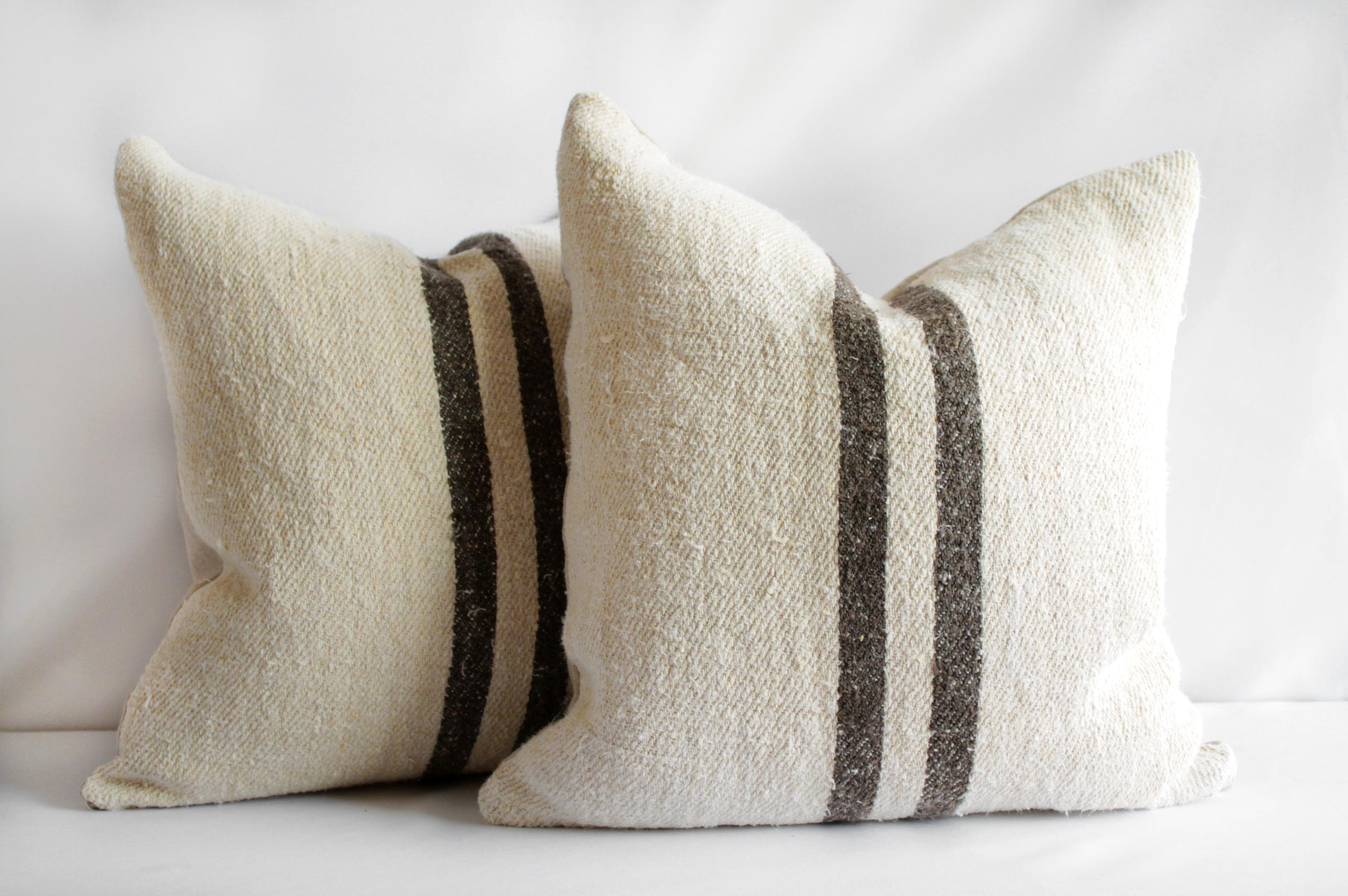 Vintage grainsack and linen pillows with dark brown stripes.
Sewn with a vintage grainsack face, and 100% Belgian Linen backing. This pillow has been finished with a hidden zipper closure and overlocked edges. Limited stock available. This can be