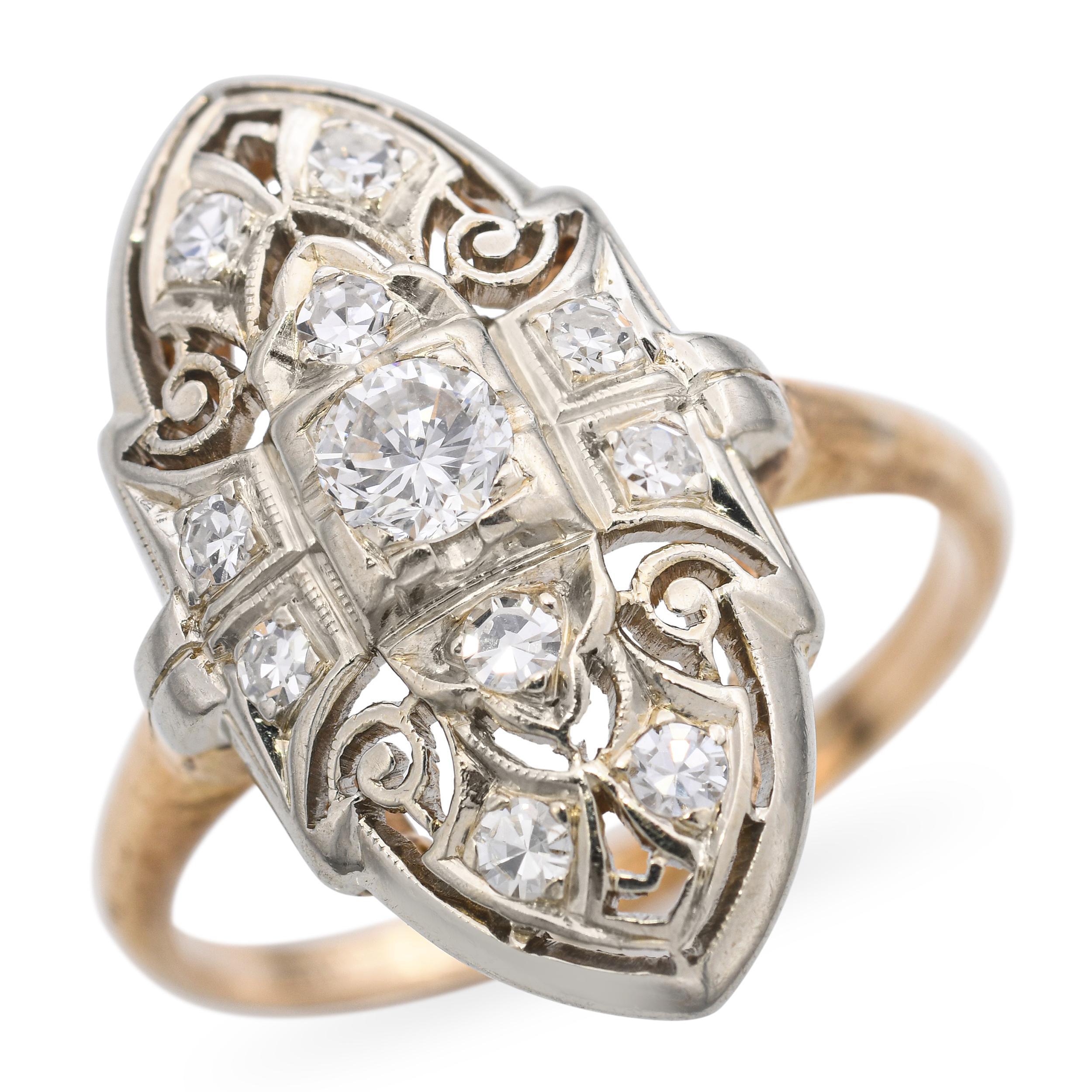 This sophisticated vintage dinner ring is crafted in a two-tone design of 14k yellow gold and 18k white gold, highlighting its elegant detailing. Set with 0.49 total carats of sparkling diamonds, the ring offers just the right amount of brilliance