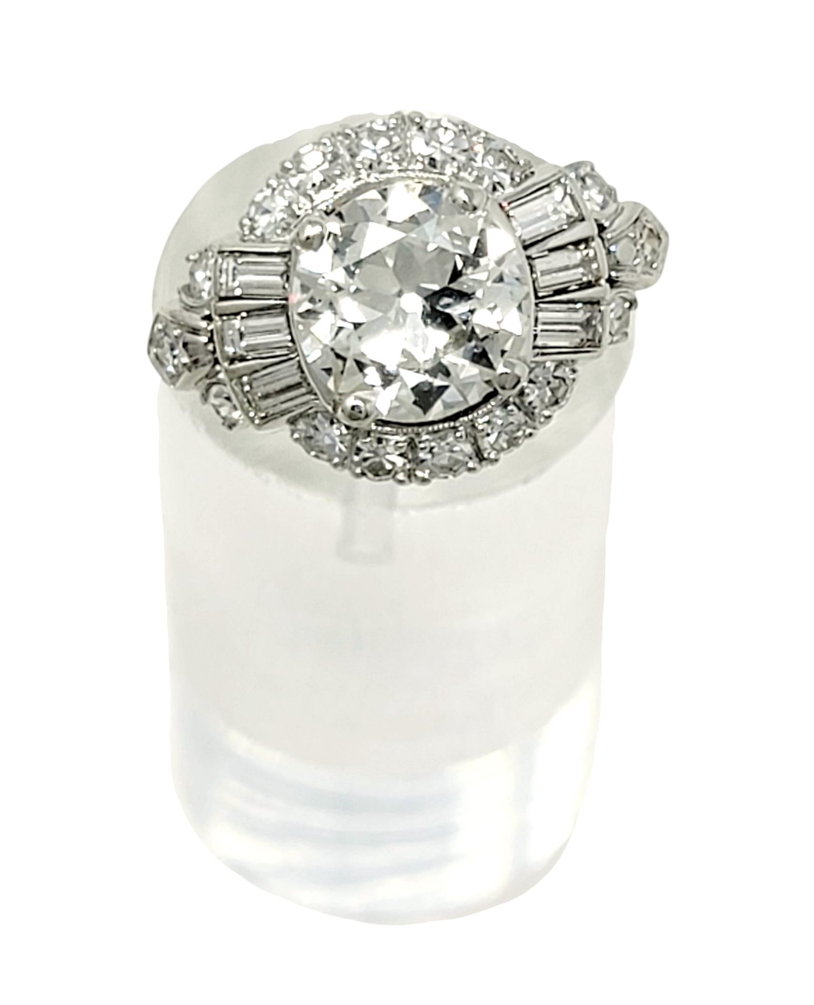 Ring size: 5.75

This stunning vintage diamond engagement ring will absolutely take your breath away. Exquisitely designed with multiple shapes of diamonds in a luxurious platinum setting, this is truly an undeniably unique piece that you will