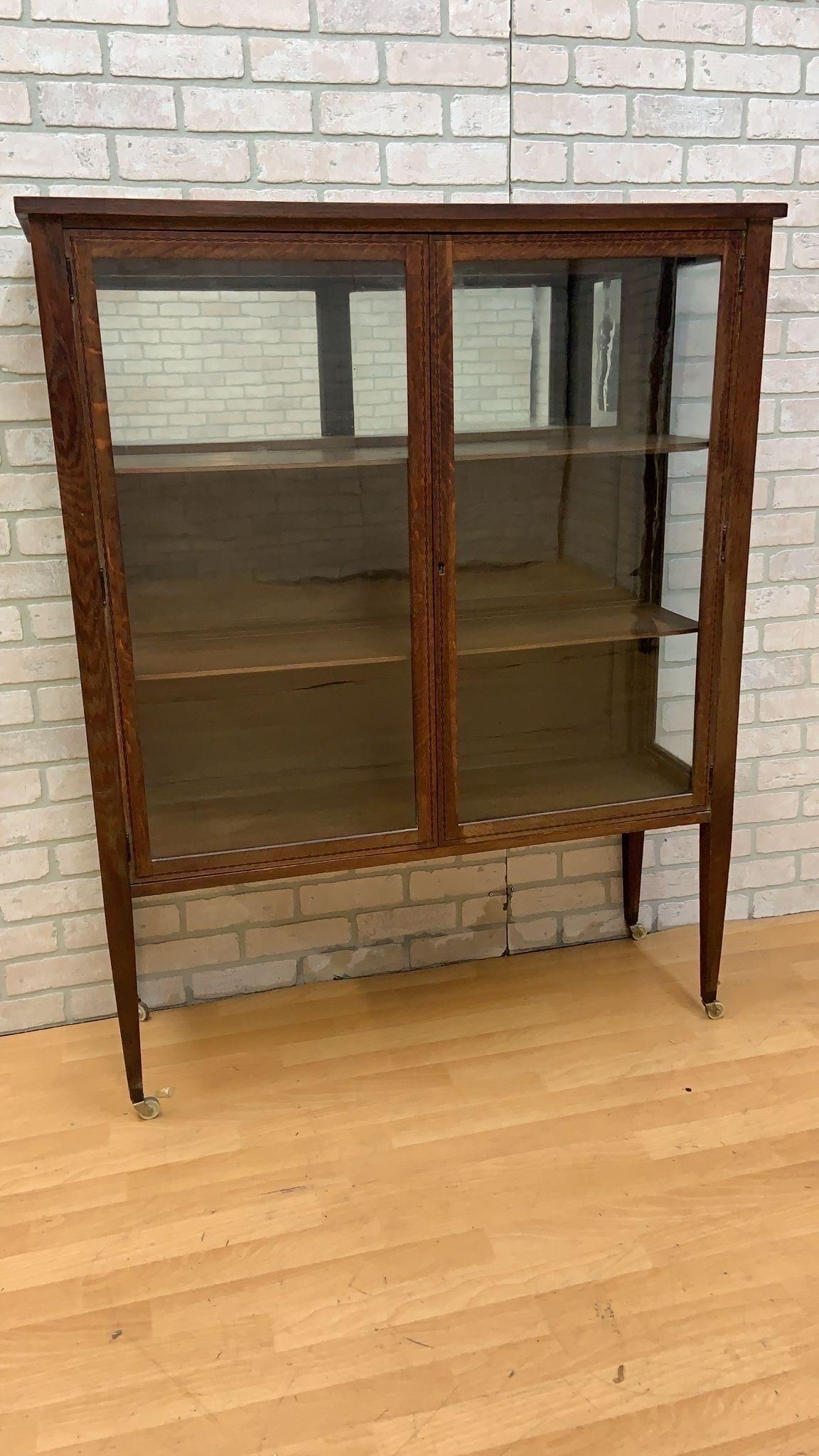Vintage Grand Rapids Bookcase and Chair Co. Glass Front Display Cabinet on Legs

This exquisite Vintage Grand Rapids Bookcase and Chair Co. Glass Front Display Cabinet combines timeless elegance with functional design. It features two spacious