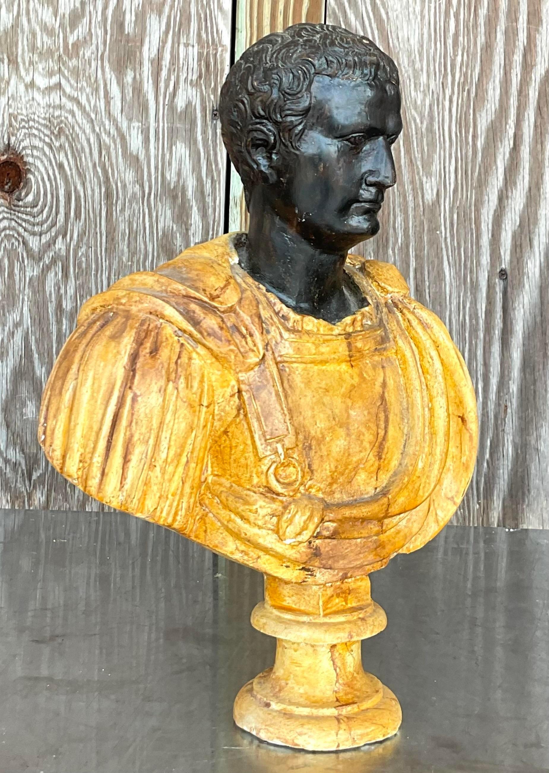 A striking vintage neoclassical plaster bust of man. A chic Grand Tour figure with a gorgeous hand painted finish. Acquired from the estate of Massimo Camilo, the designer for Gianni Versace. Two other busts from the same series also available on my