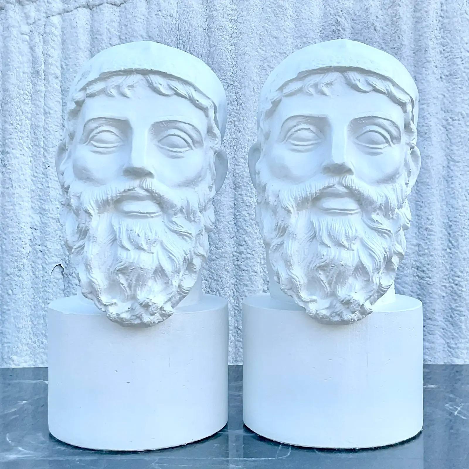 A fabulous pair of vintage plaster busts. A handsome man with an even more handsome beard. Done in the grand tour style. Painted a bright white. Acquired from a Palm Beach estate.