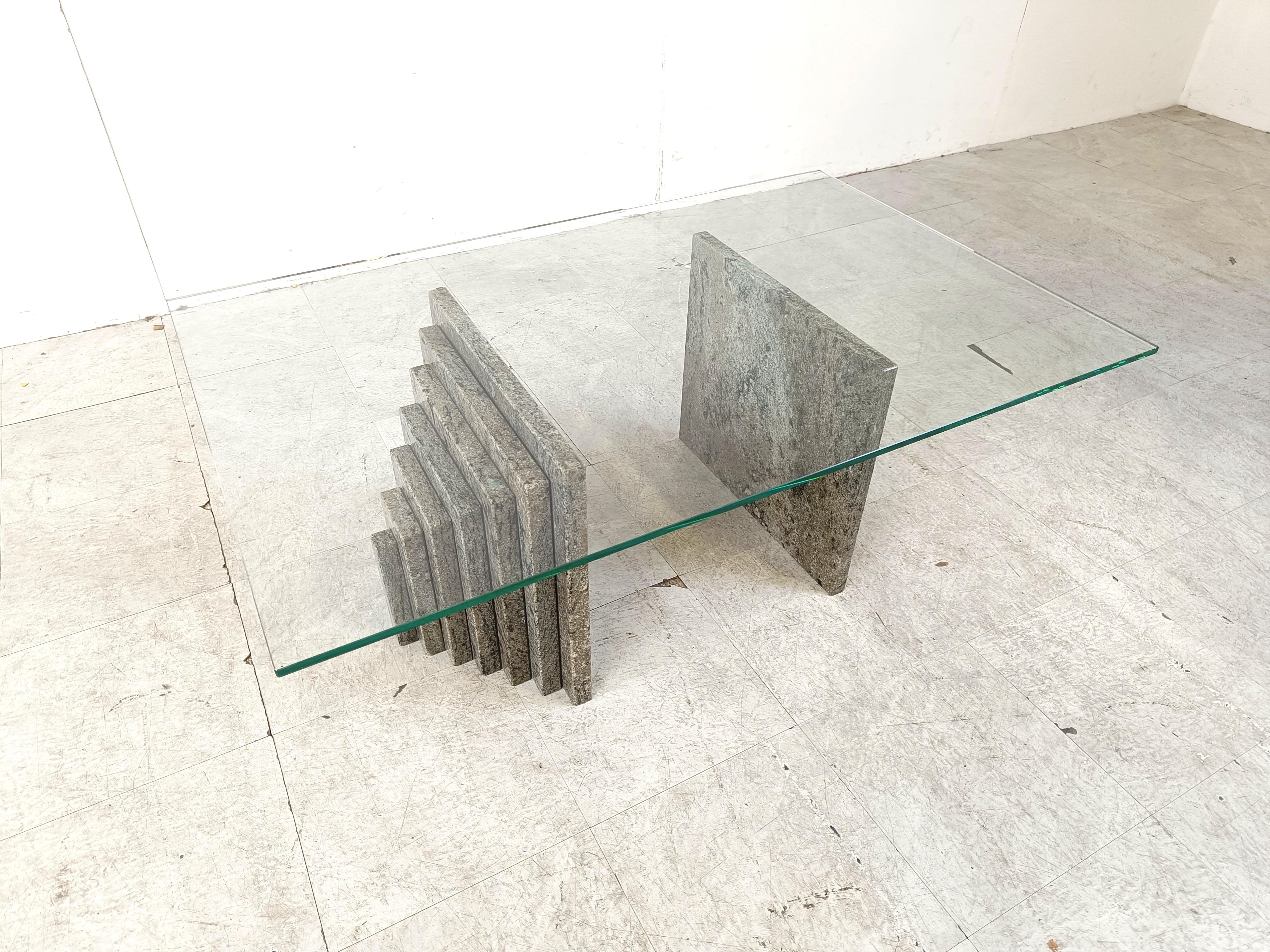 Vintage coffee table with a clear glass rectangular top and stepped granite stone bases.

Very n ice, timeless design with beautiful natural granite.

1980s - Italy

Dimensions: 
Height:  40cm
Width: 110cm
Depth: 70cm

Ref.: 655546