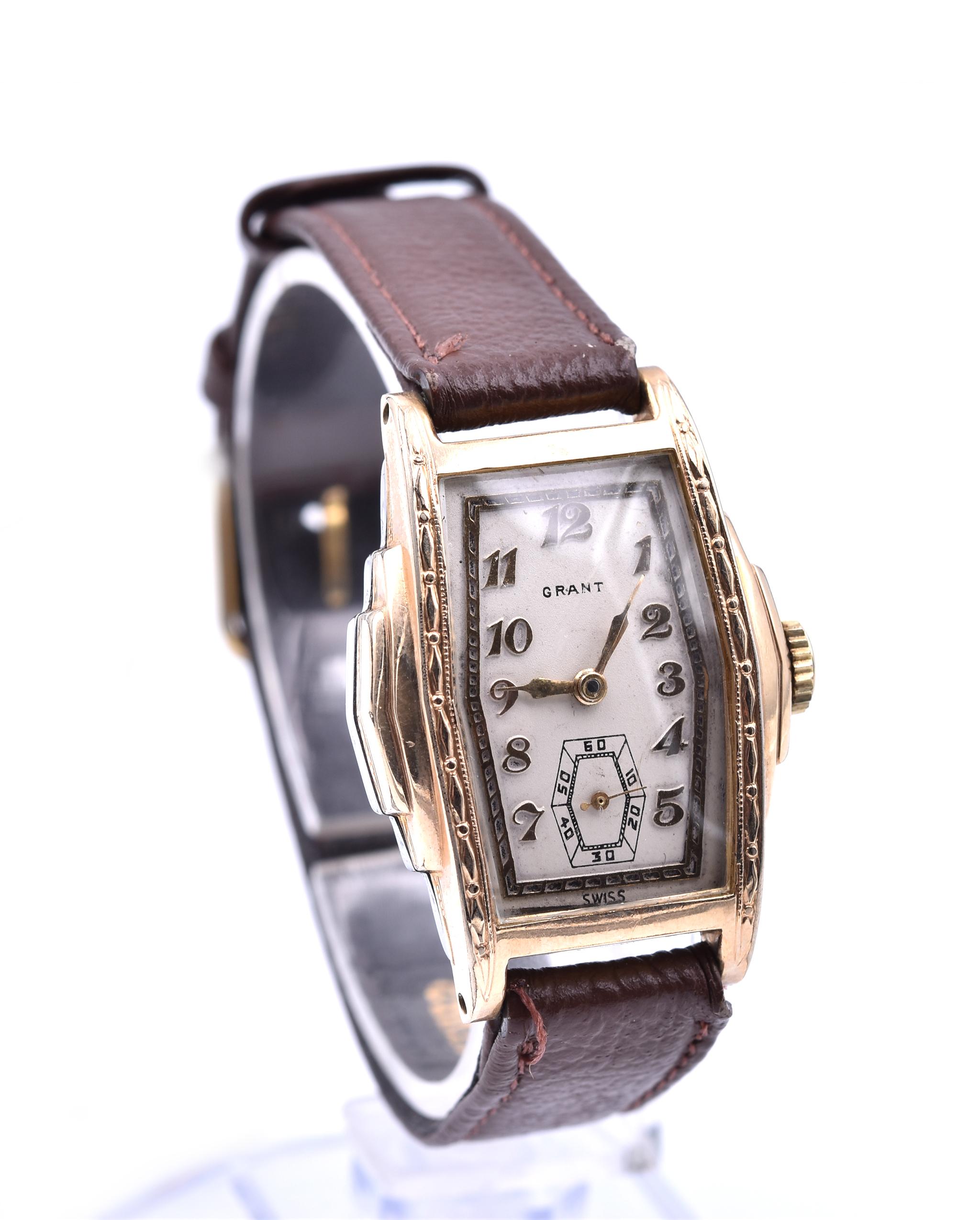 Movement: mechanical wind 7 jewels
Function: hours, minutes, sub-seconds
Case: rectangular 41.8mm x 30.4mm gold-tone stainless steel case, solid case back, plastic crystal, pull/push winding crown
Dial: white dial with gold-tone hands, gold-tone