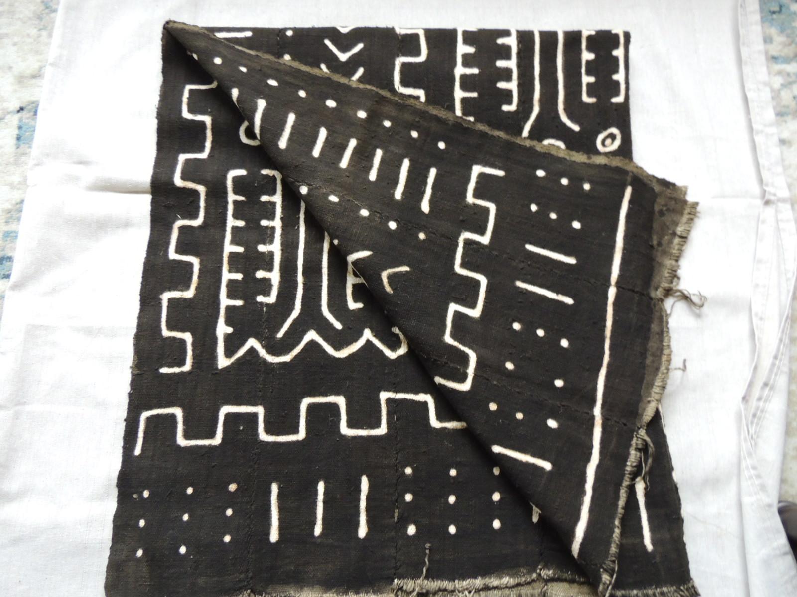 Vintage graphic Bogolanfini African mud cloth panel
Vintage Graphic black and natural Bogolanfini African mud cloth panel. Bolt pattern. 
Bògòlanfini or bogolan (Bambara: is a handmade Malian cotton fabric traditionally dyed with fermented mud. In