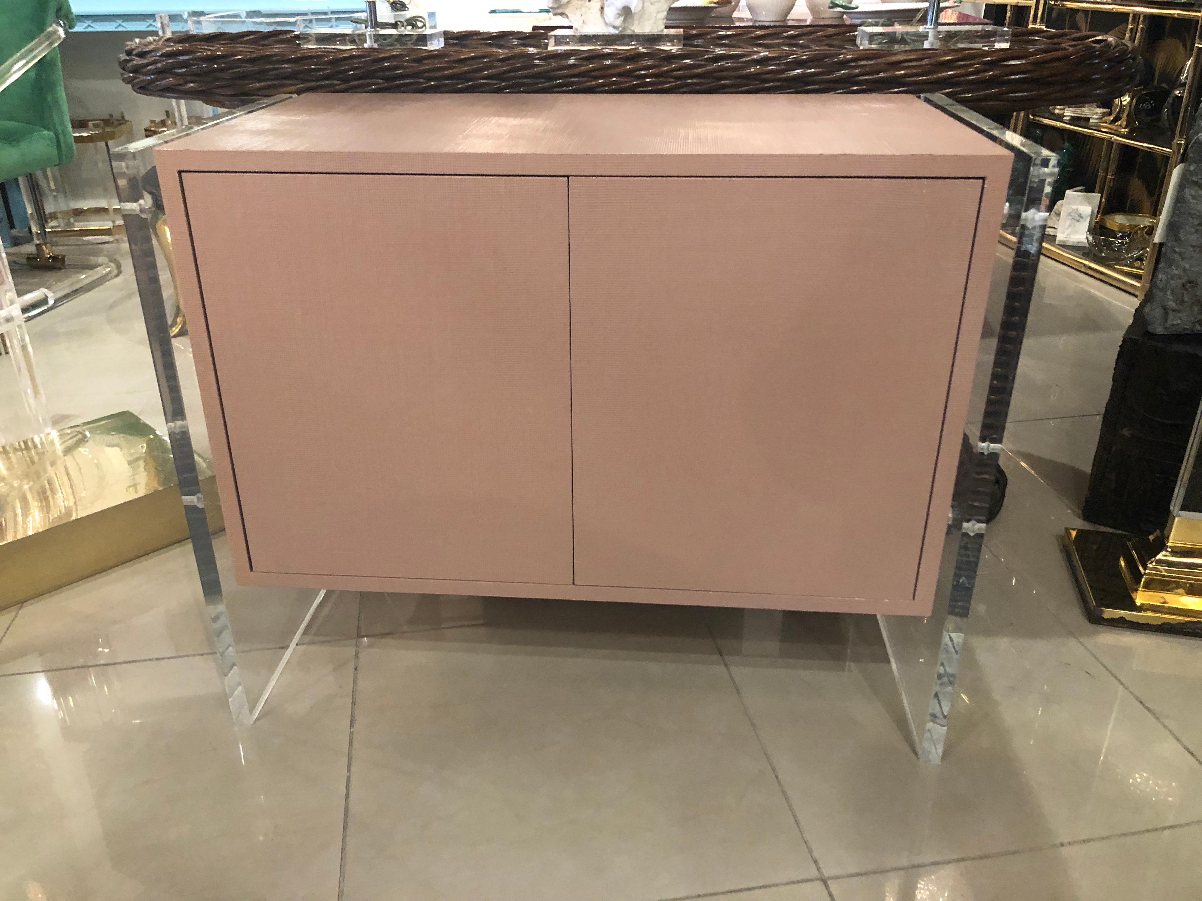 Vintage grasscloth credenza with Lucite sides. One shelf behind the double doors. The lacquered surface was as found. Can be lacquered in another color if desired for an additional cost.