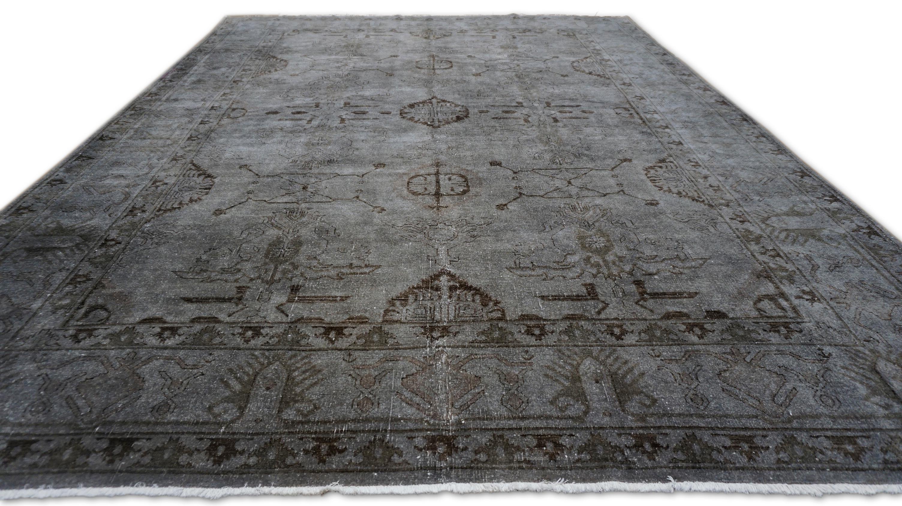 This stunning vintage Oushak rug is a masterpiece of hand-knotted craftsmanship, woven using traditional techniques that date back centuries. Known for their distinctive designs and muted color palettes, Oushak rugs like this one are highly sought
