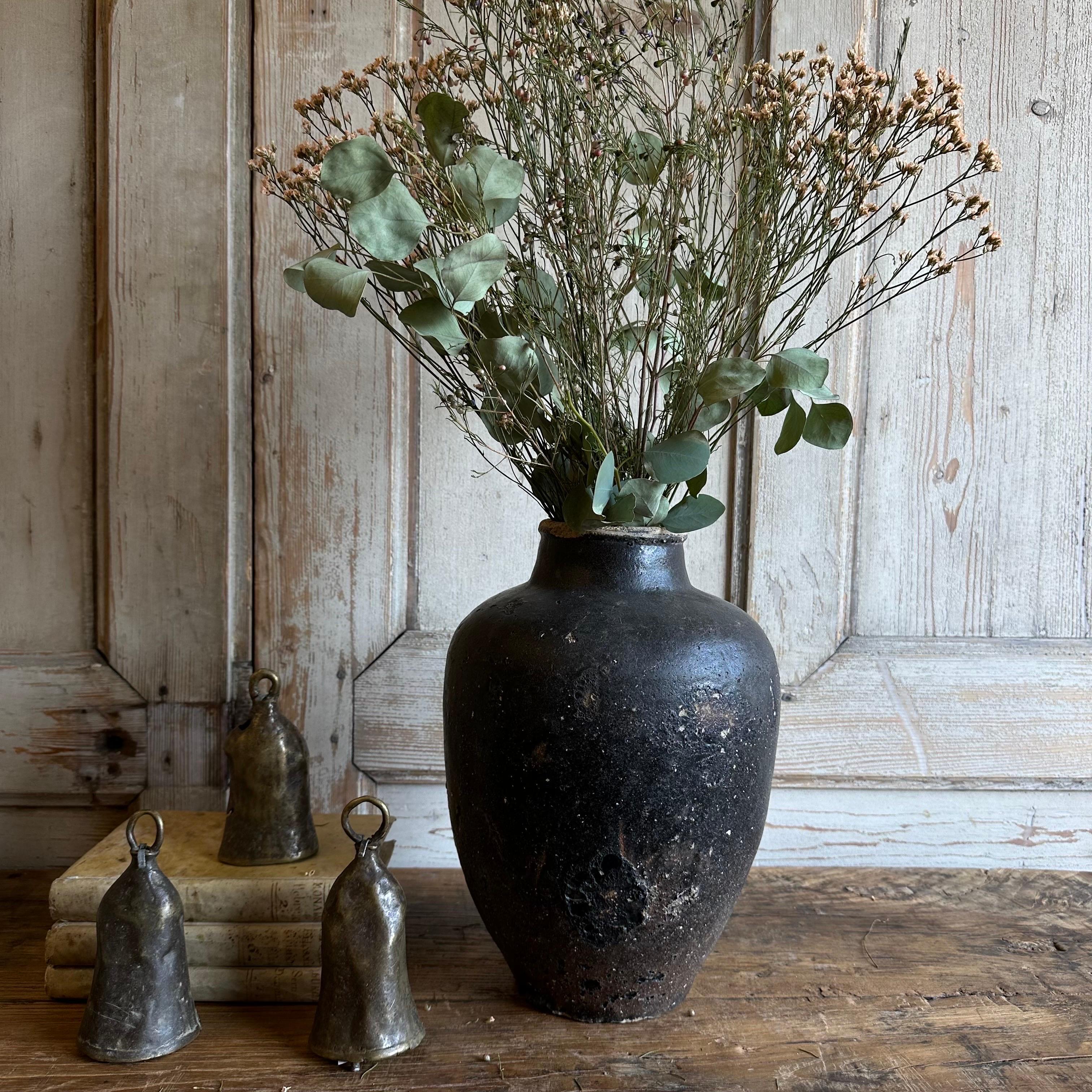Vintage glazed pottery rich in character, this vintage oil pot adds just the right amount of texture + warmth where you need it. Stunning matte finish with dark gray brown muddy hues, with a washed antique look. Each piece is uniquely special with