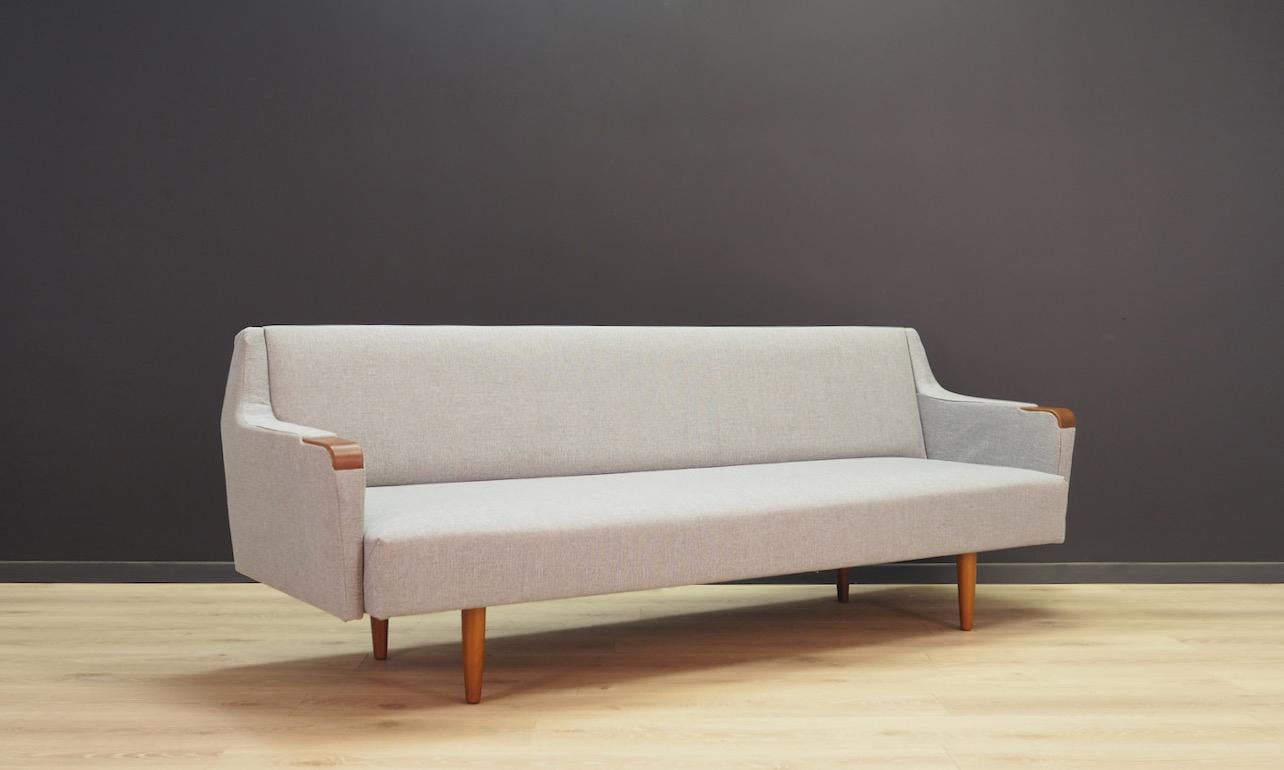 Phenomenal sofa from the 1960s-1970s, a beautiful Minimalist form - Scandinavian design. The sofa is covered with new upholstery (color - gray). Teak armrests. Preserved in good condition (minor scratches on the armrests) - directly for