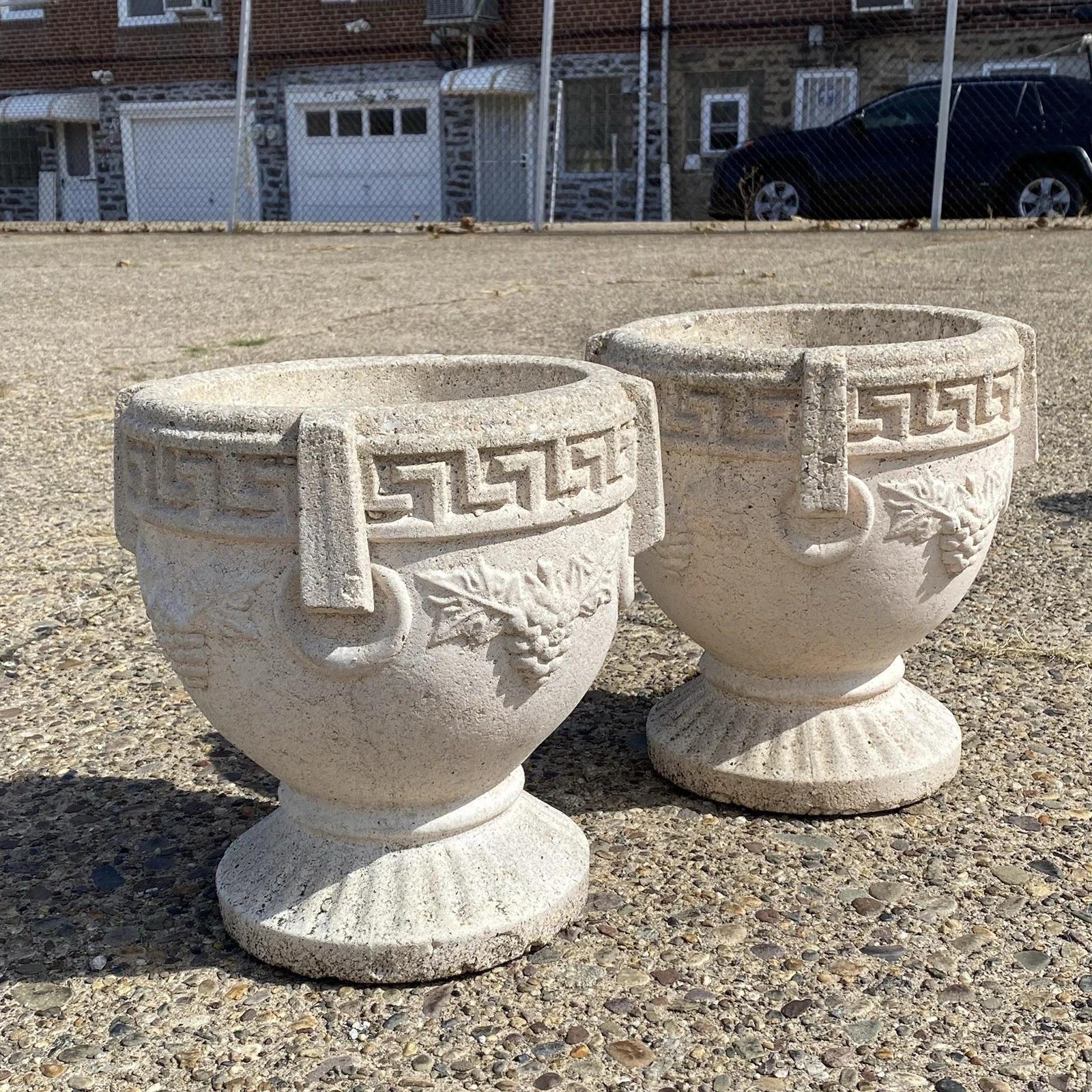 Please message us with your zip code to request a more reasonable domestic U.S. shipping quote.

Vintage Greek Classical Style Concrete Urn Form Greek Key Grapevine Garden Flower Planter Pot - a Pair. Approx 50 lbs each. Circa Late 20th Century.
