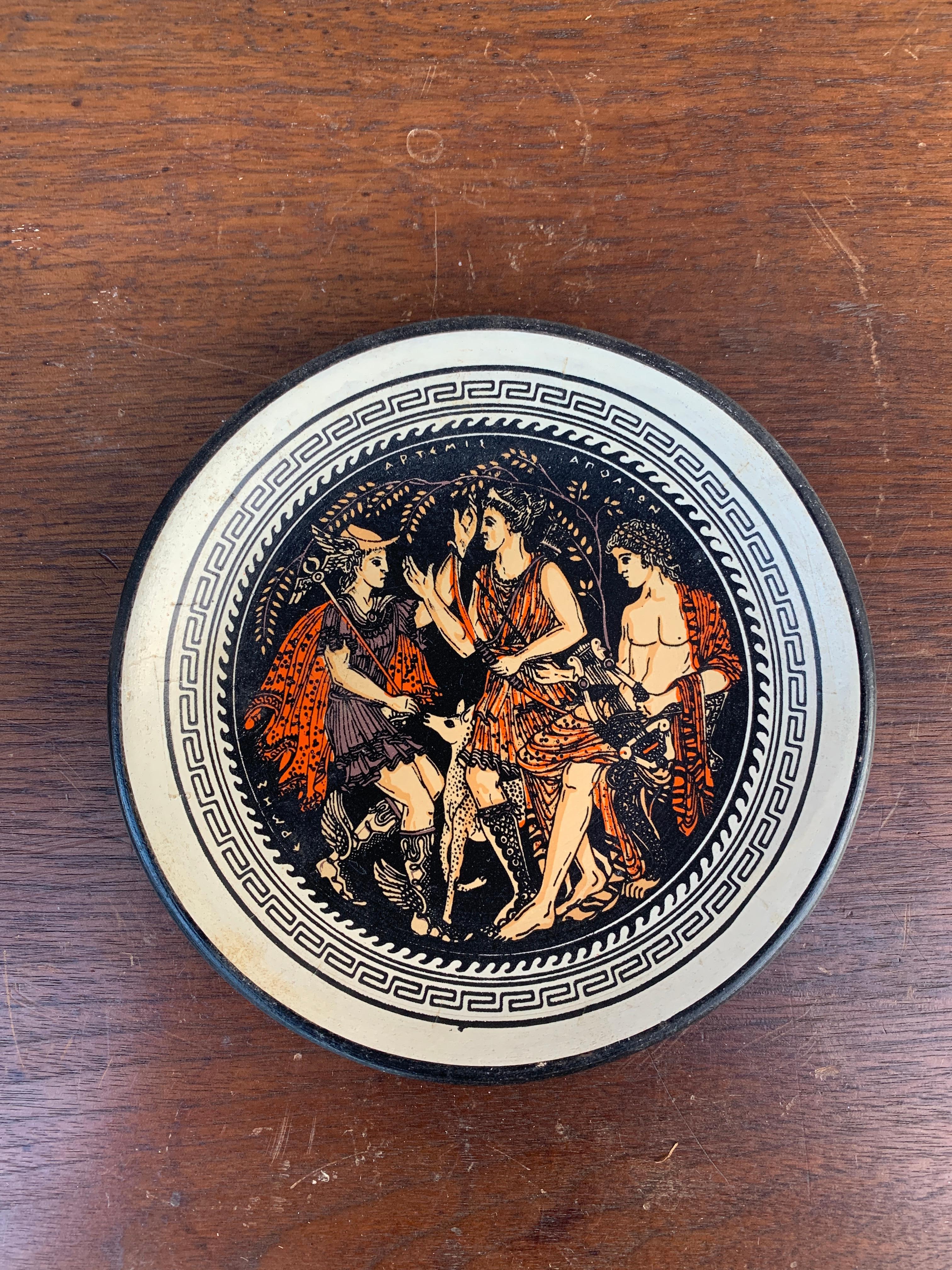 A beautiful vintage decorative Greek wall plate featuring mythological warriors and a Greek key border

Greece, Mid-20th Century

Hand painted terracotta

Very good original vintage condition.