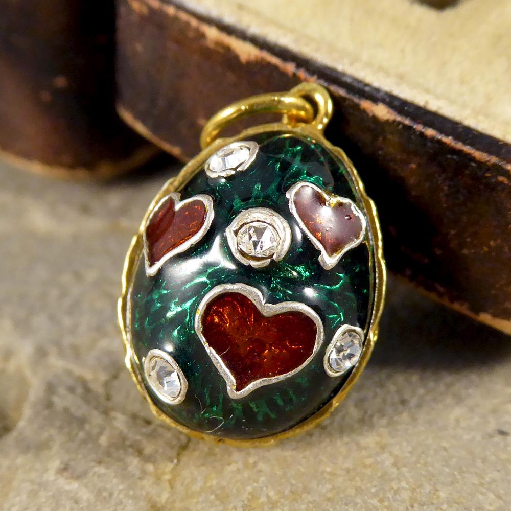 This funky pendant charm features green and red guilloche enamel and paste stones in silver gilt.
With a heart motif, it would make the perfect gift for a loved one!

Condition: Very Good, slightest signs of wear due to age and use
Defects: