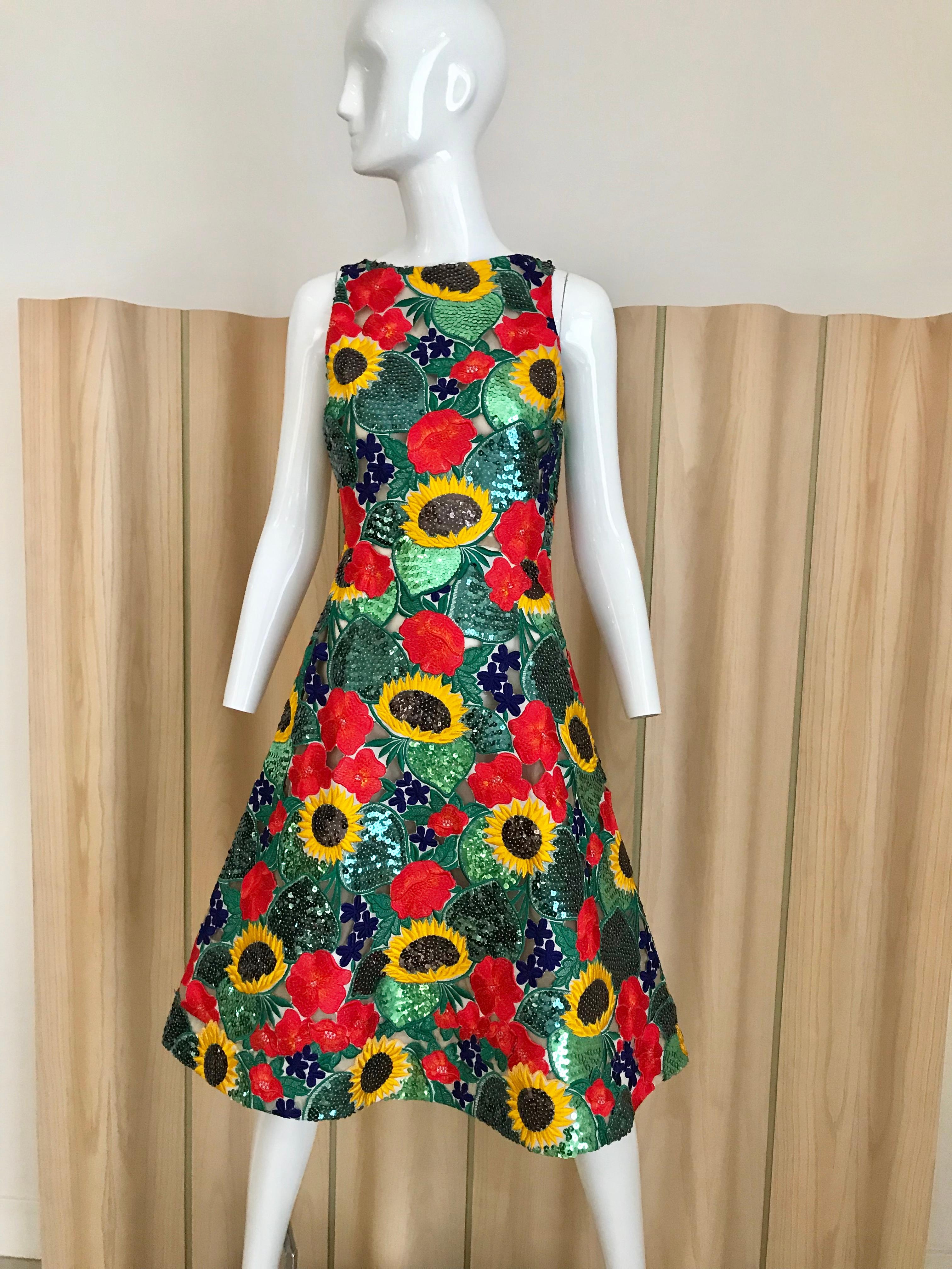 Green and red sunflower sequins sleeveless cocktail dress. 
Fitted at the waist with flair hem. Dress is lined in silk.
Bust: 34 inches/ Waist: 27inches