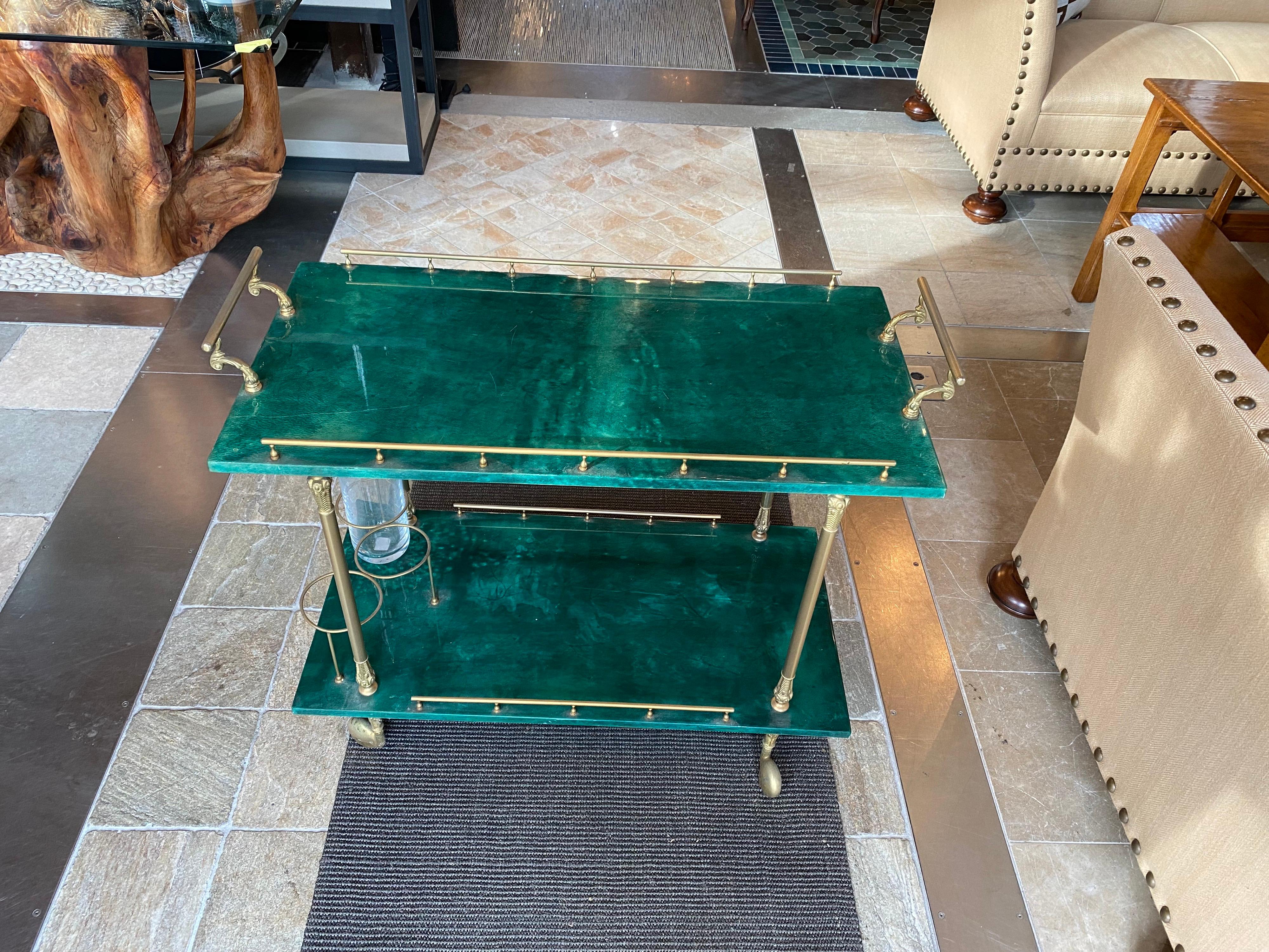 Vintage green bar cart with brass hardware

Measures: 33