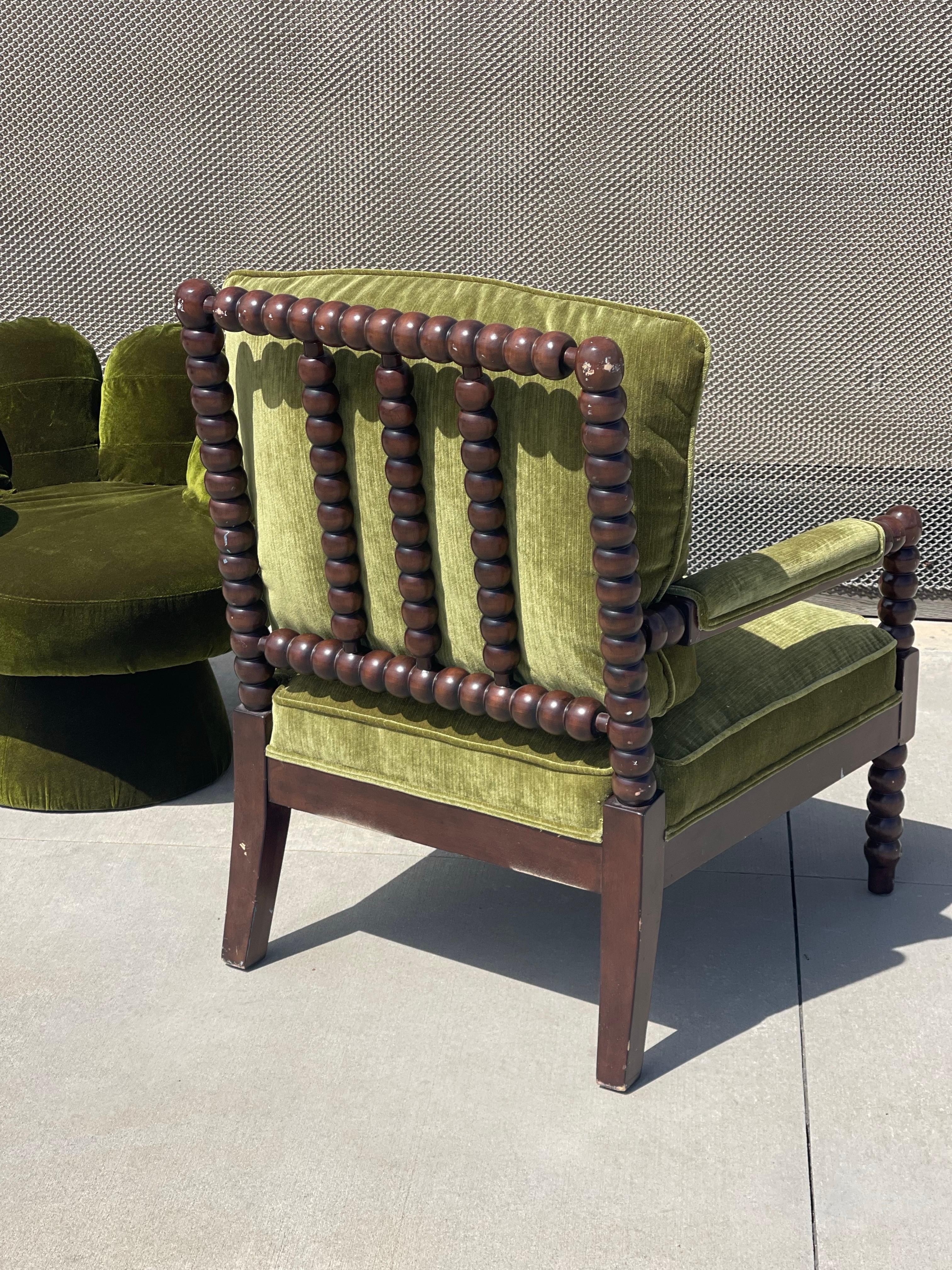 Vintage green bobbin arm chair, newly redone in micro striped green velvet. 